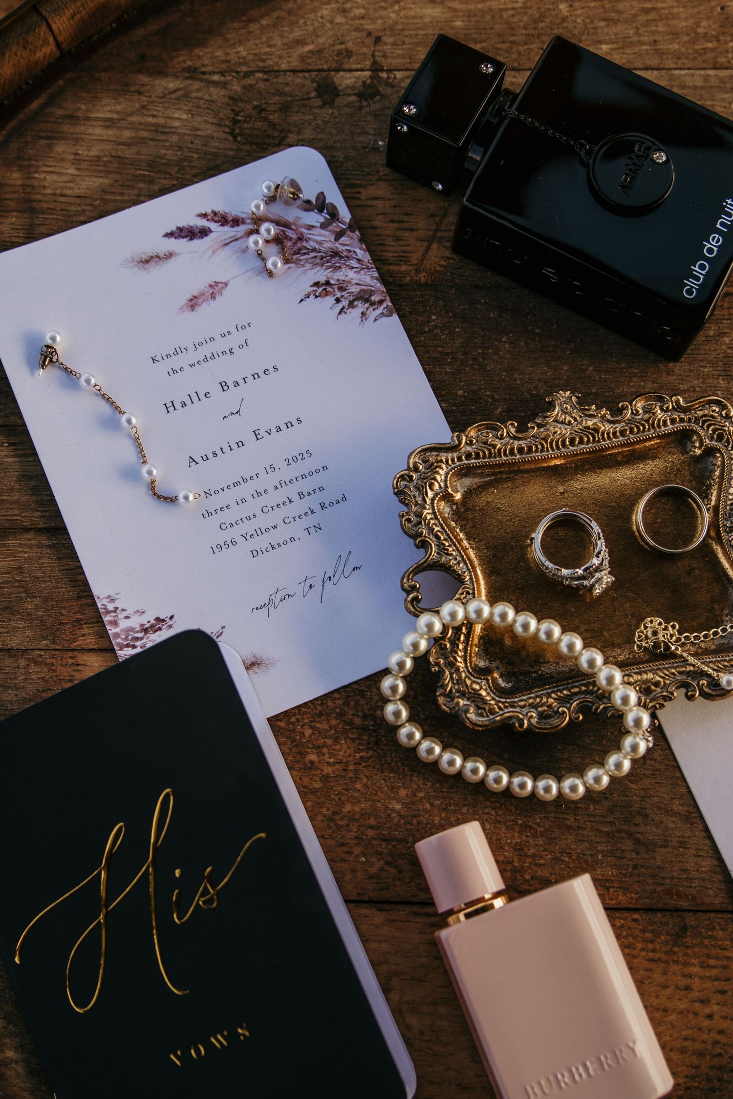 detail photo of bride and grooms rings with invitation and jewelry