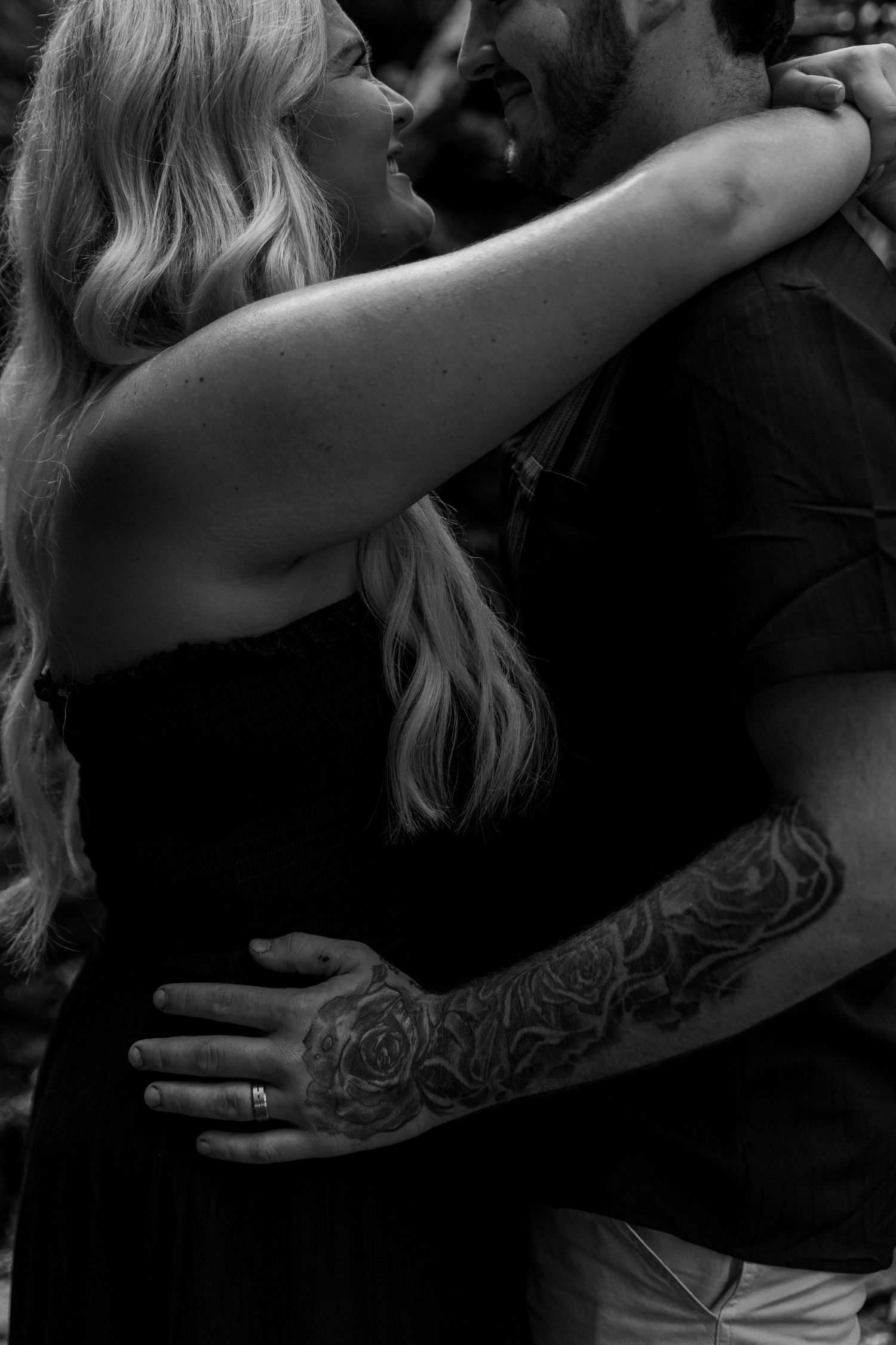 guy and girl hugging each other closely