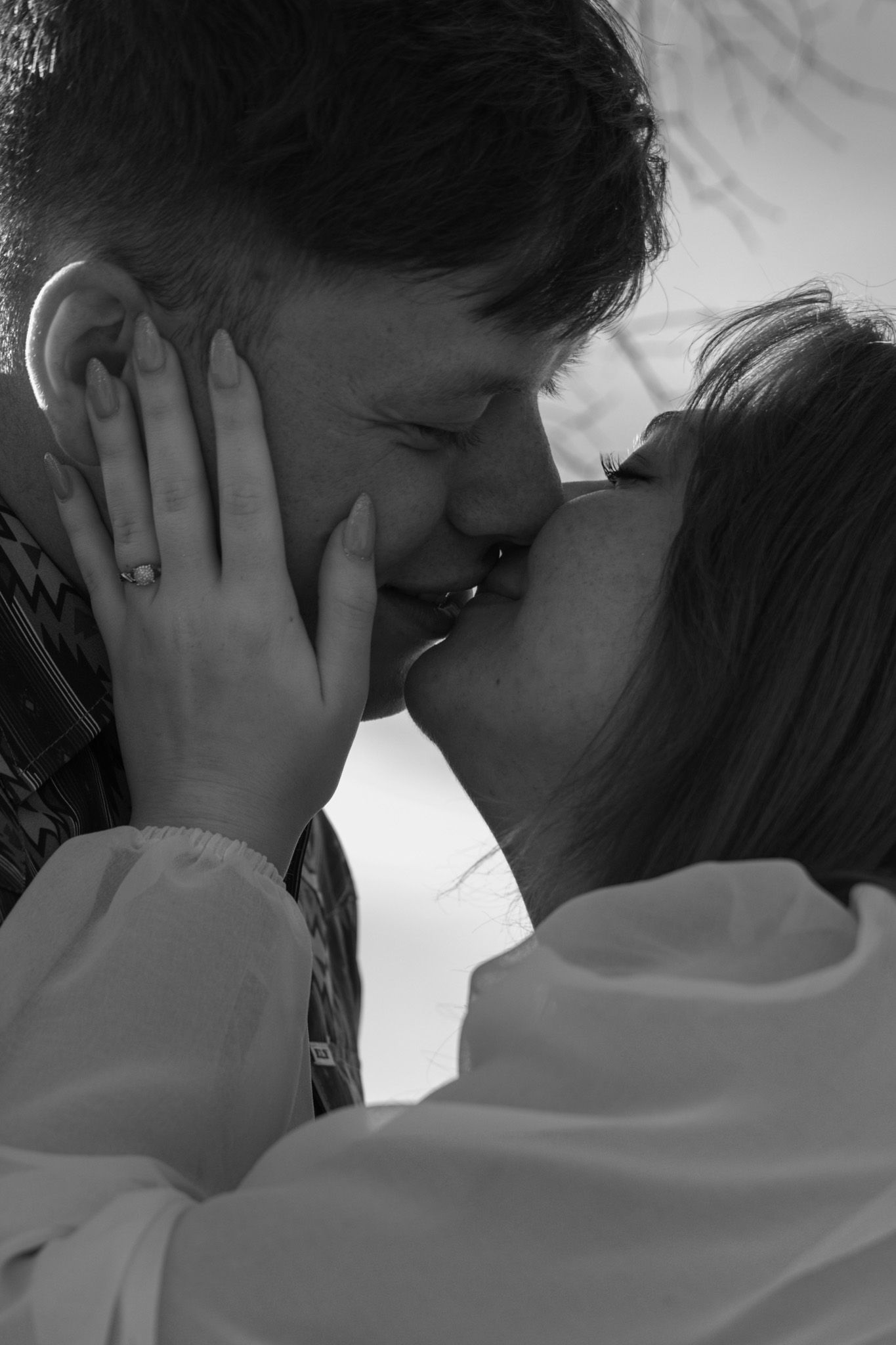 Boy and girl very close to each other about to kiss after getting engaged.