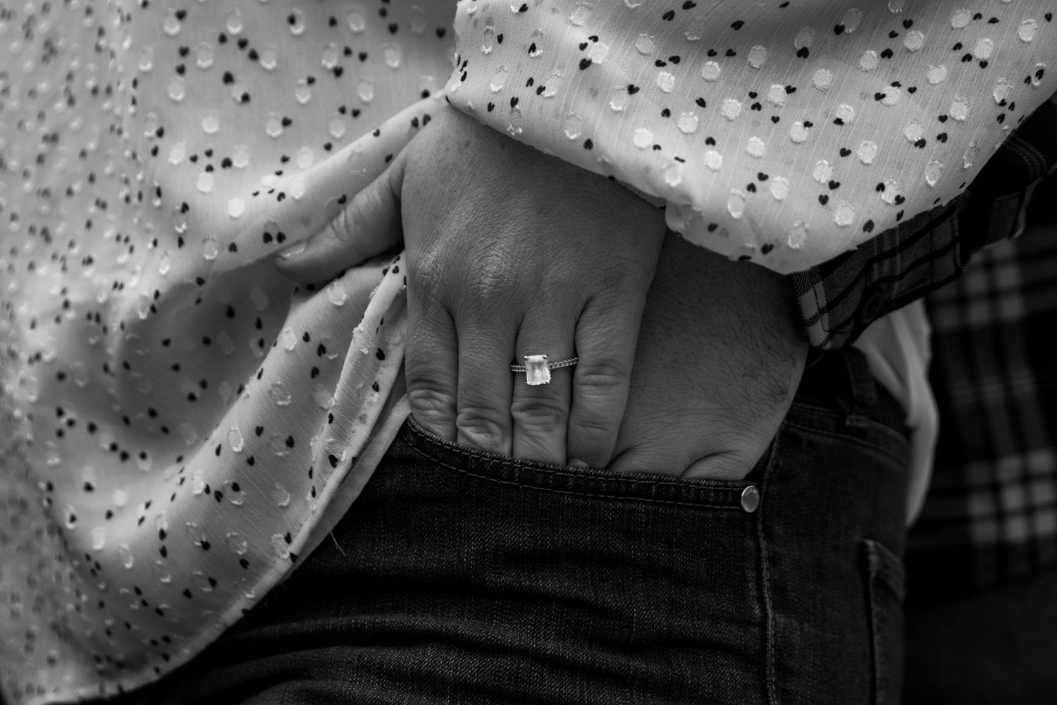 ring detail shot with hands in pocket