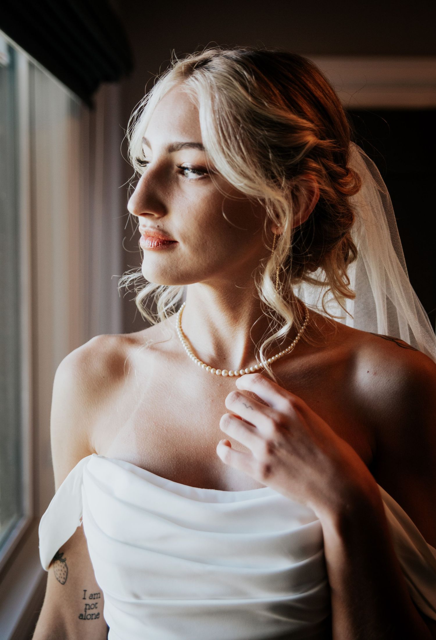 Bohemian bride by a window during Palmer Lake wedding near Colorado Springs