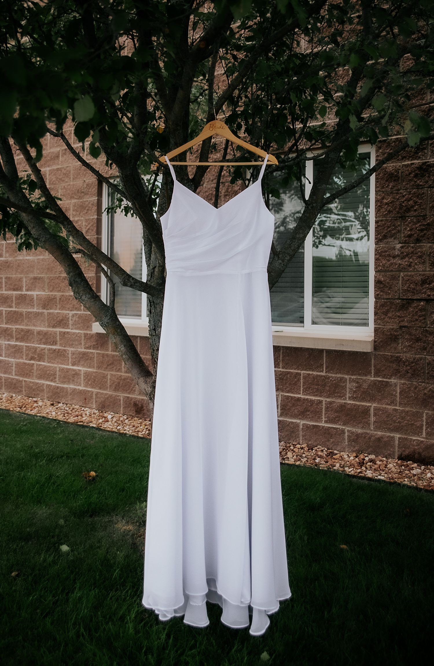 Close up shot of a wedding dress during a summer wedding, from Colorado Springs wedding photographer Jasmine Morse