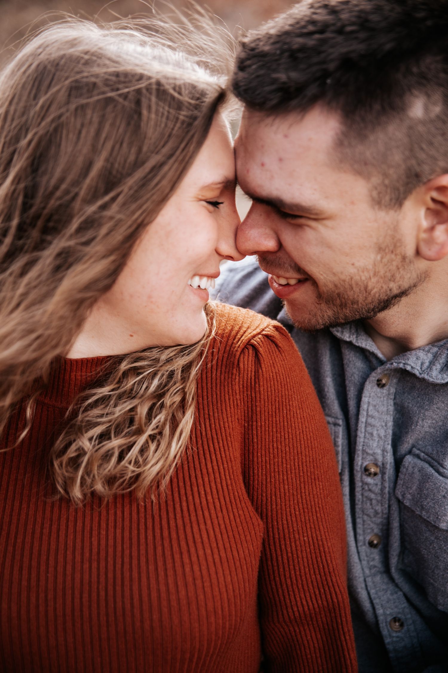 An intimate close-up shot captures tender moments between an expecting couple.