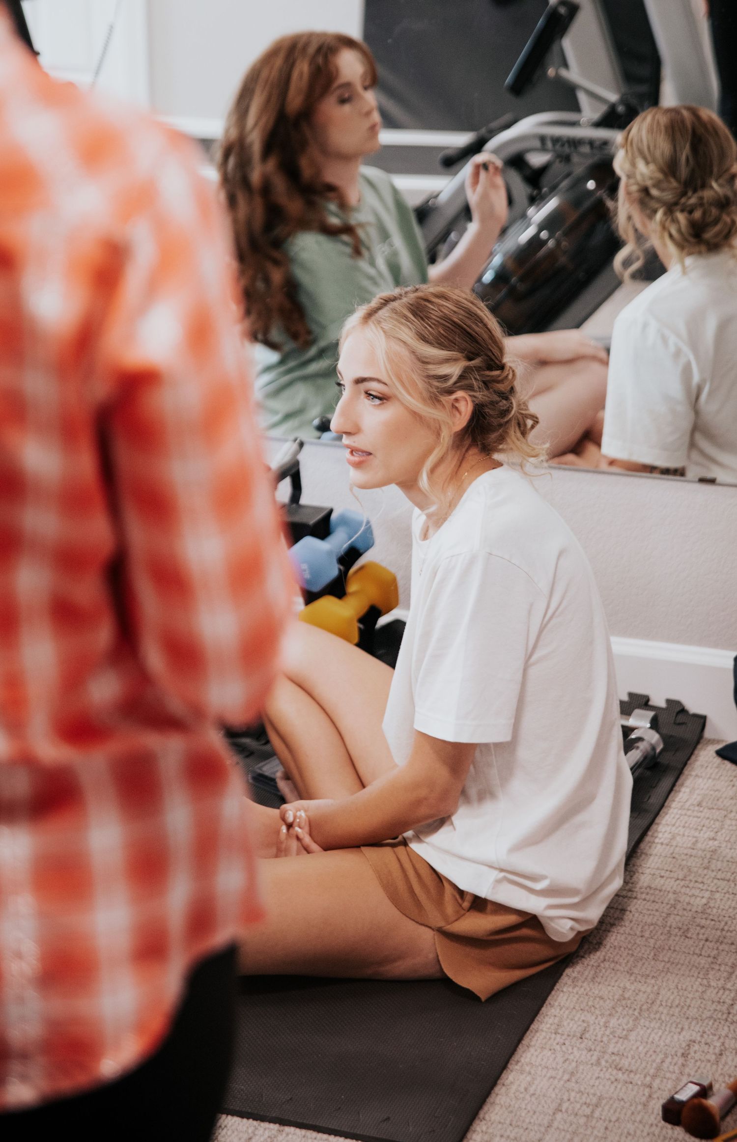 Wedding preparation scene with styling session in progress.