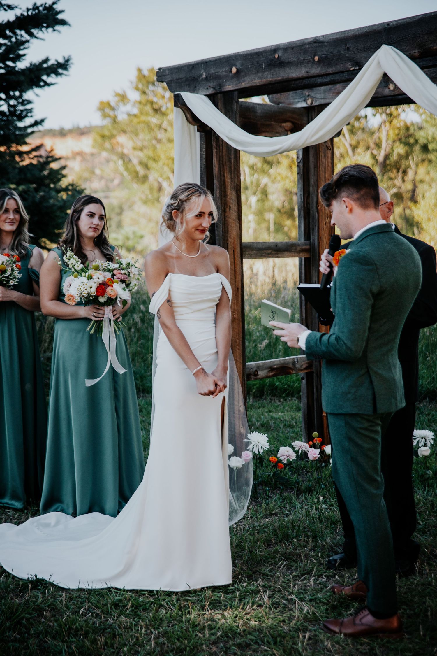 Couple reading vows during outdoor ceremony at wedding in Palmer Lake near Colorado Springs