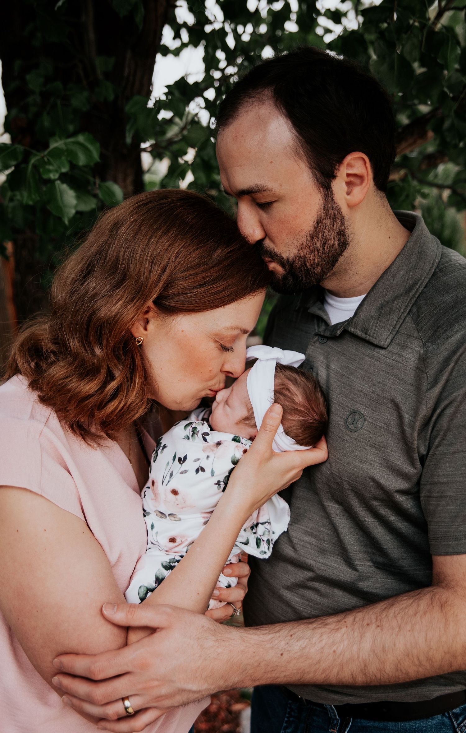 A tender family moment captured in a series of intimate photos showing parents bonding with their newborn baby.