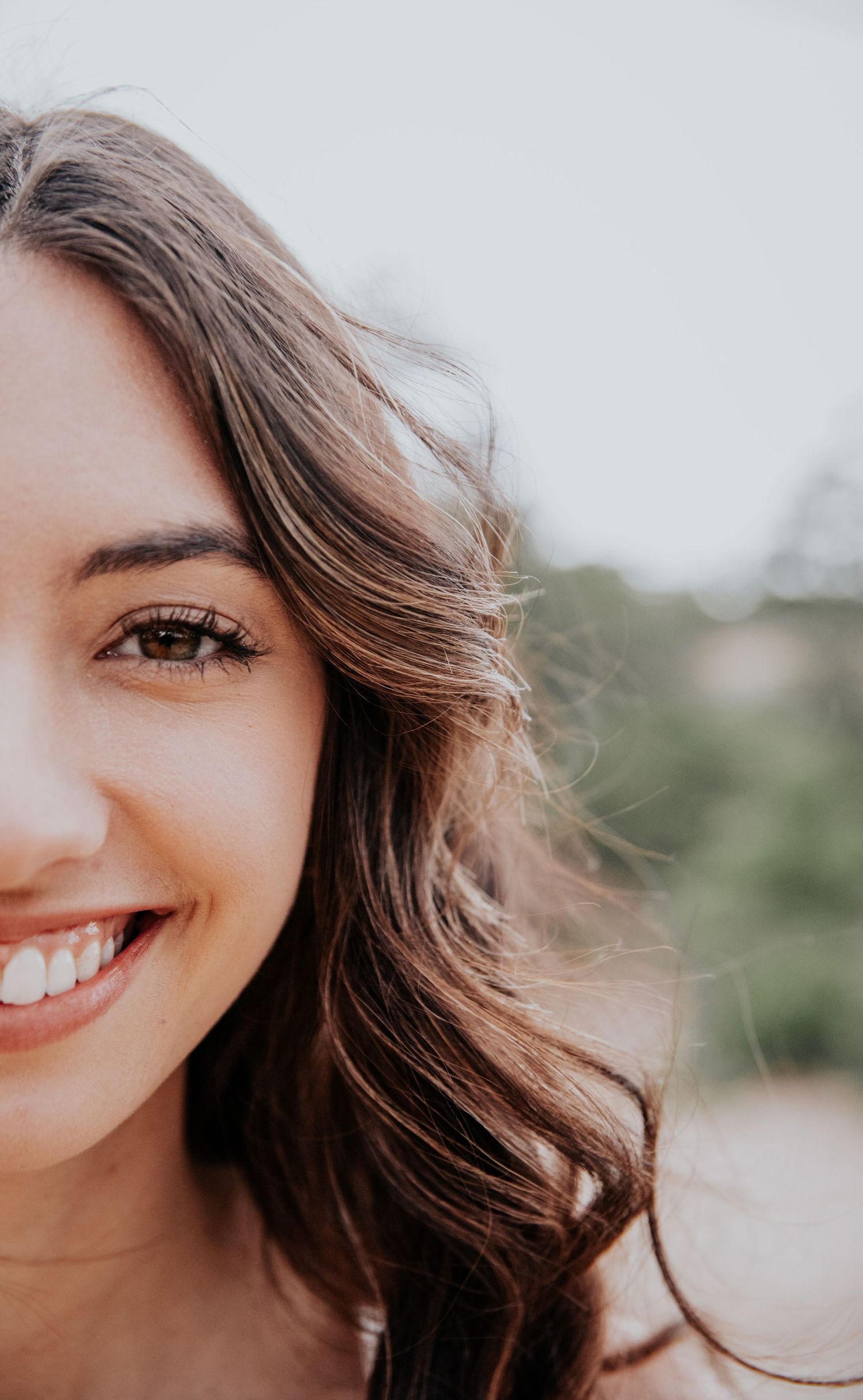 Progressive close-up shots of wavy brown hair and bright smiles.