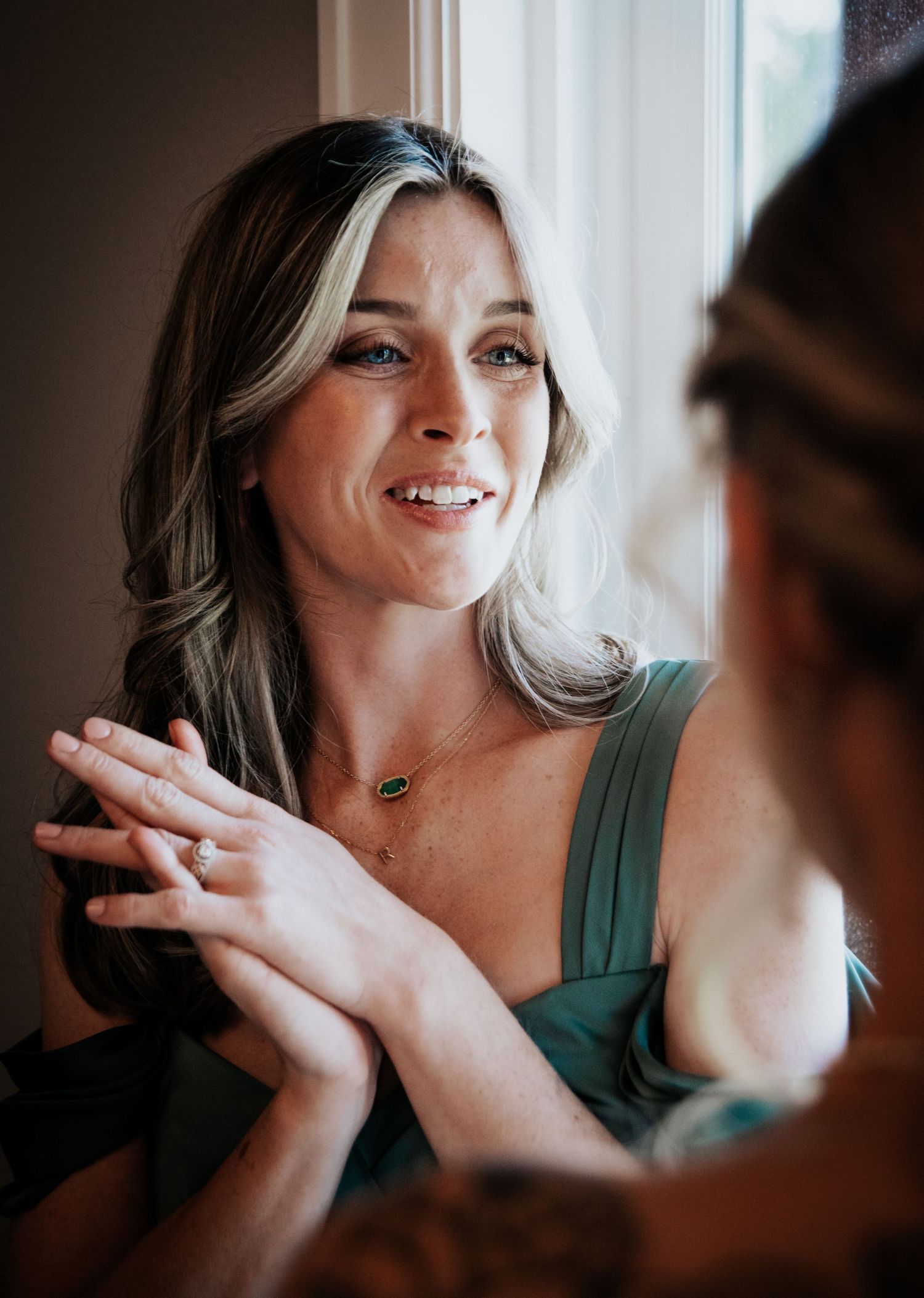 Candid moment of excitement during wedding preparations.