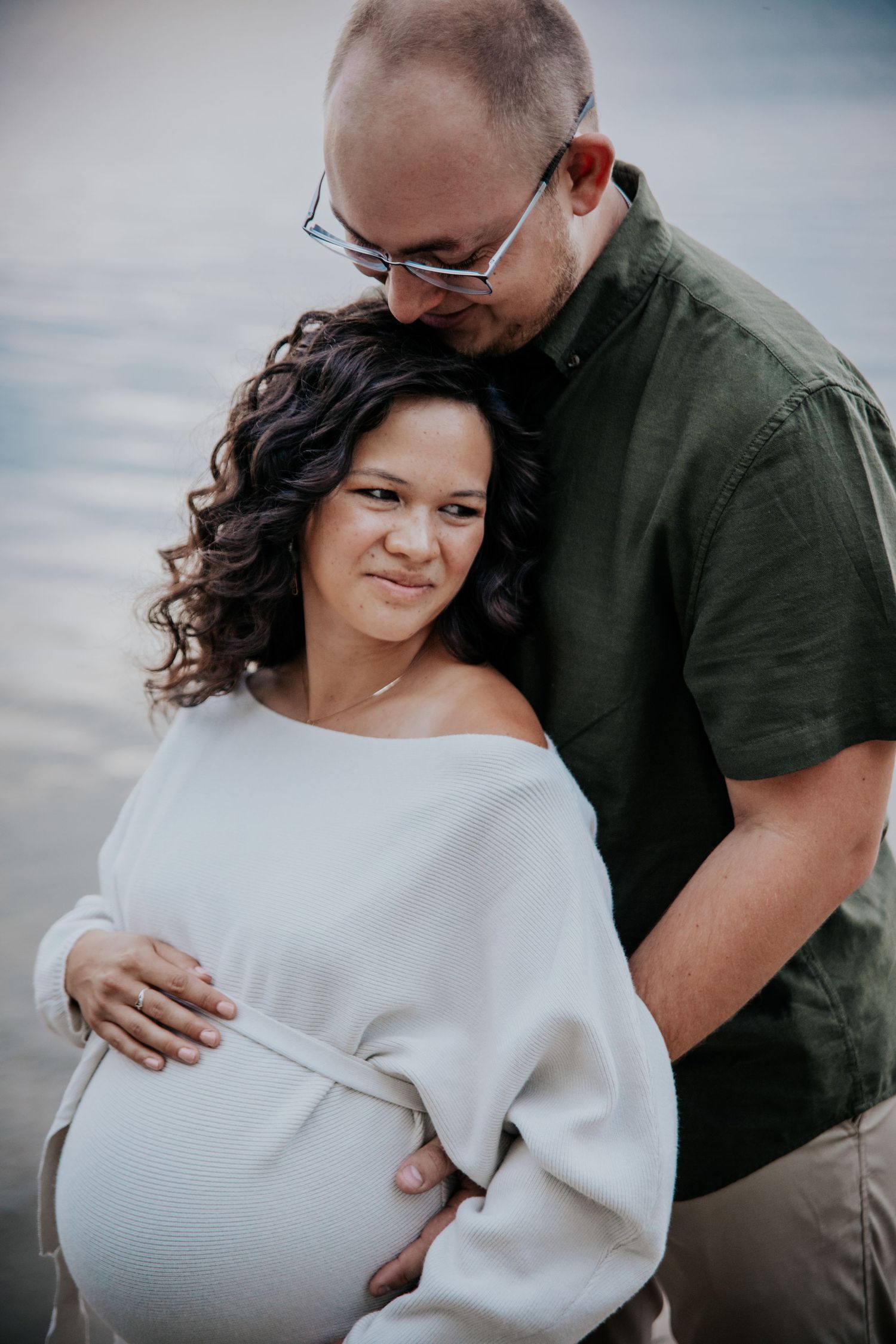 Emotional maternity portraits showing tender moments between expecting parents.