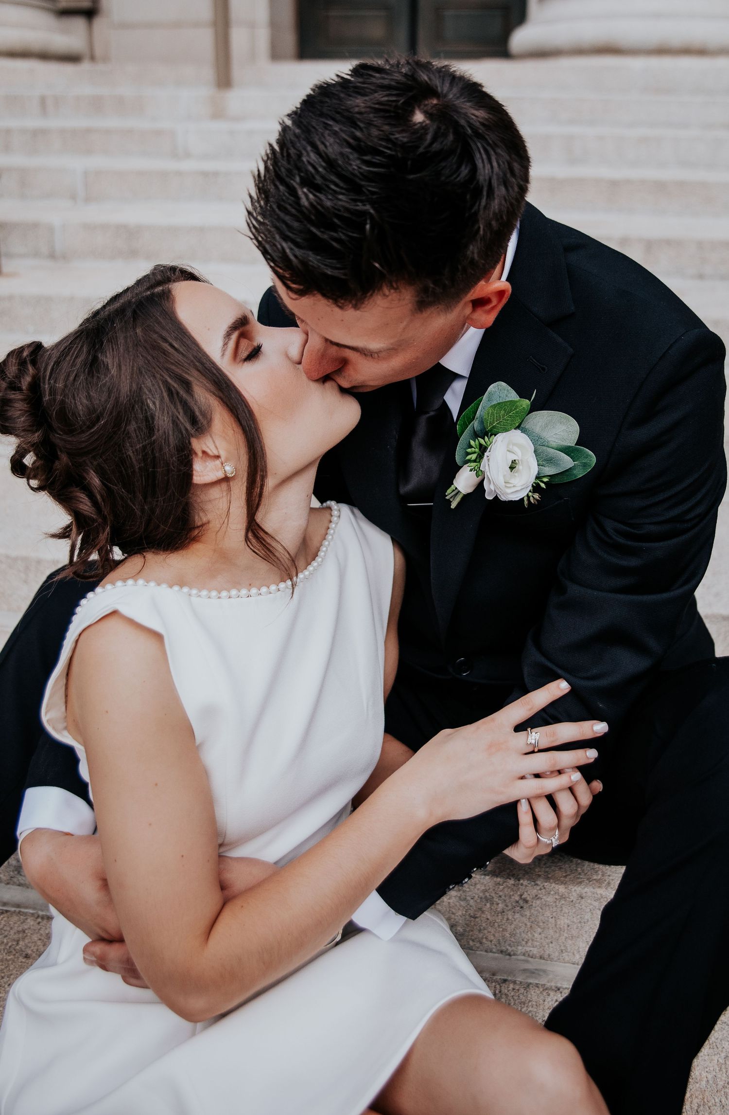 A romantic sequence of wedding photos showing a couple sharing intimate kisses in formal attire.