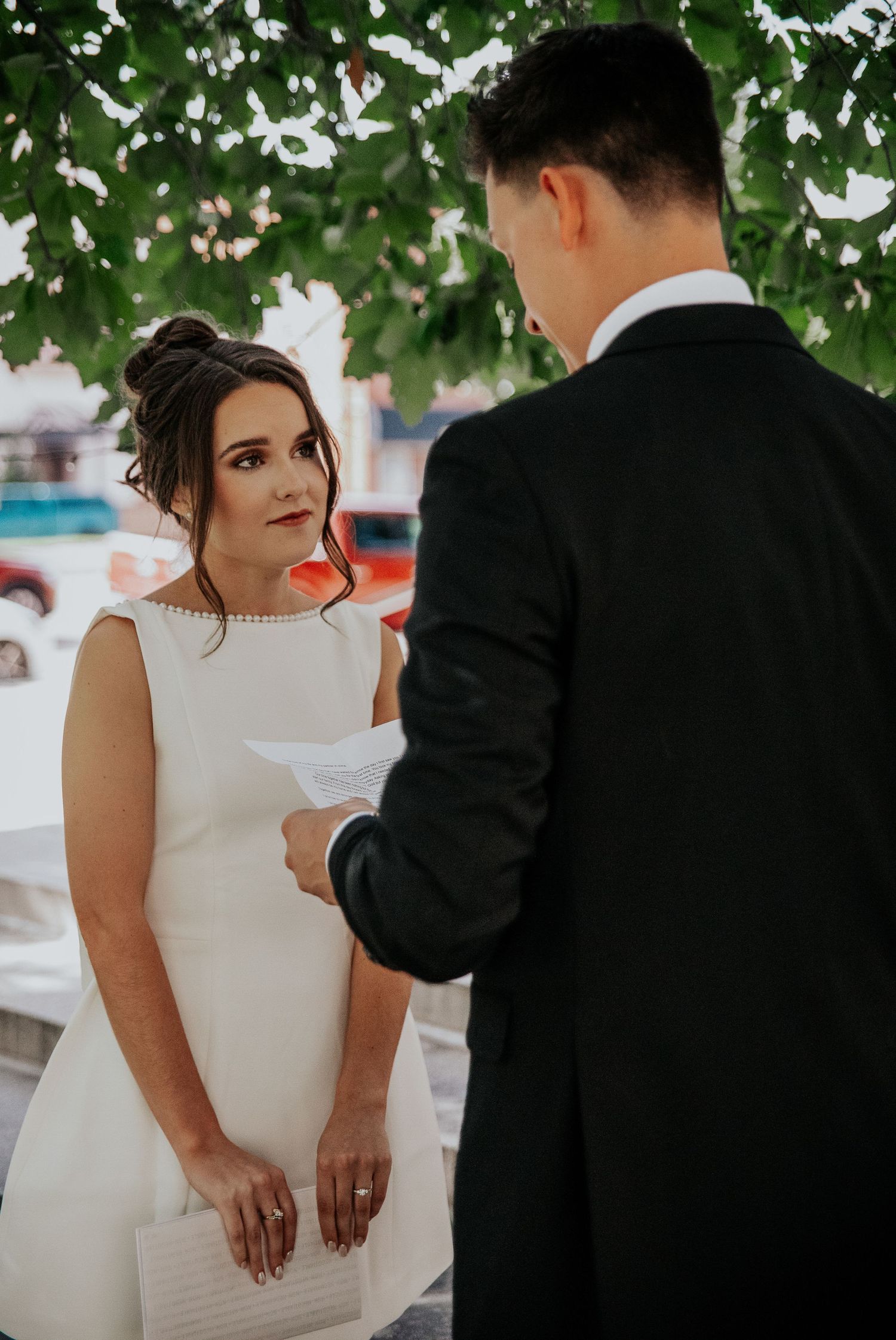 A romantic moment showing tender interactions between a bride and groom at Colorado Springs courthouse wedding.