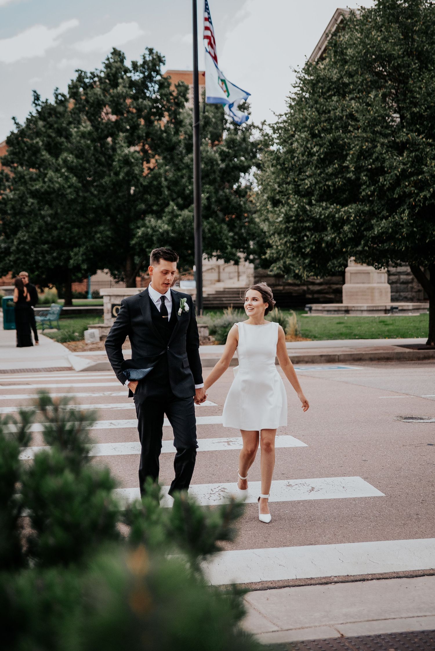 Sequence of wedding photos showing couple walking together on a paved outdoor area with trees in background.