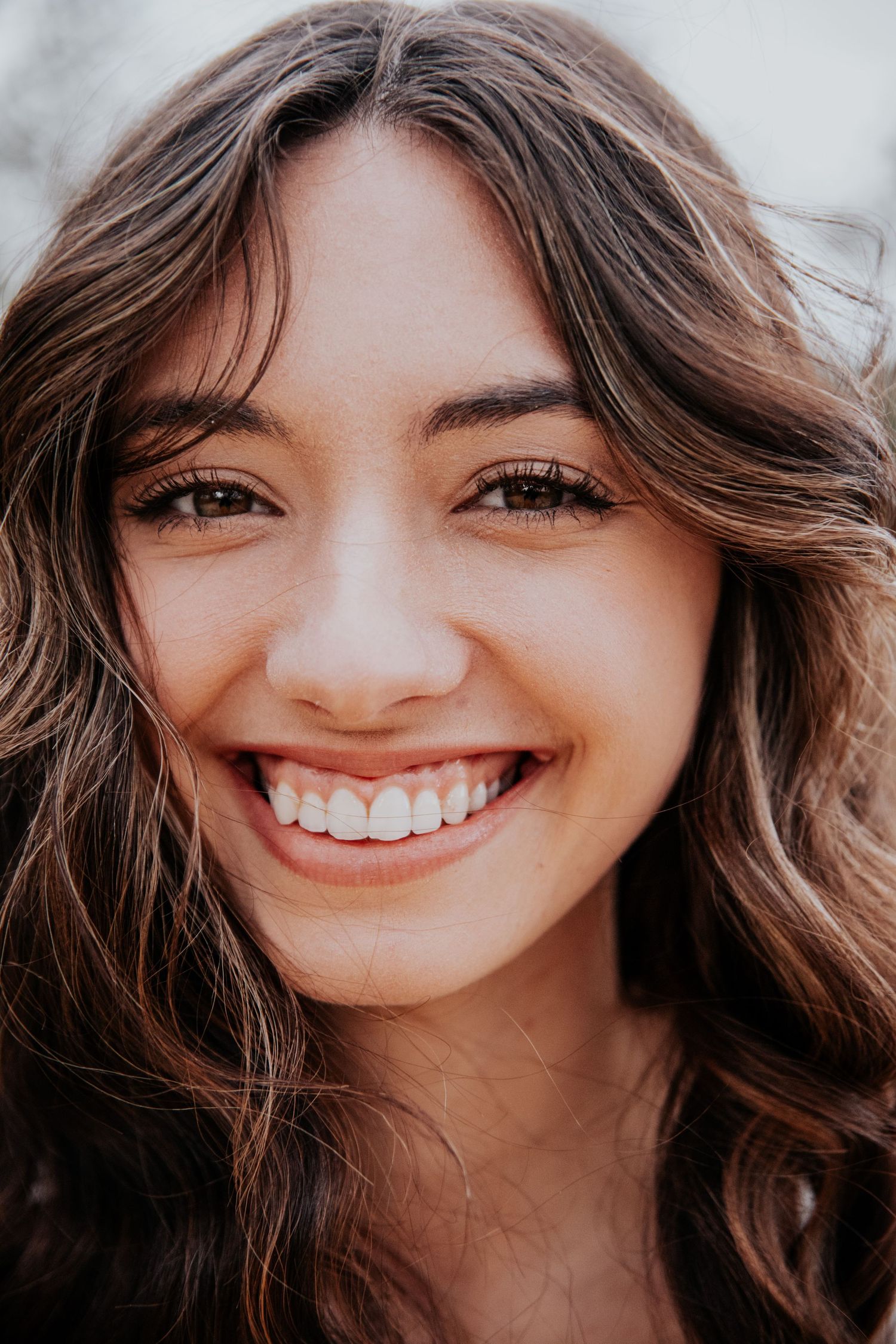 A series of natural beauty shots showcasing joyful expressions.