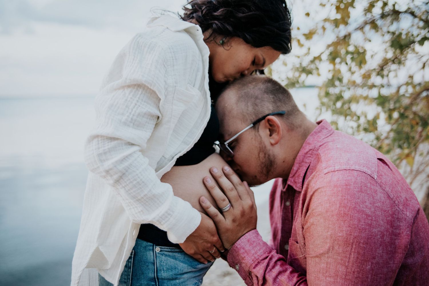 Intimate couple's portrait session captured at a lakeside location.