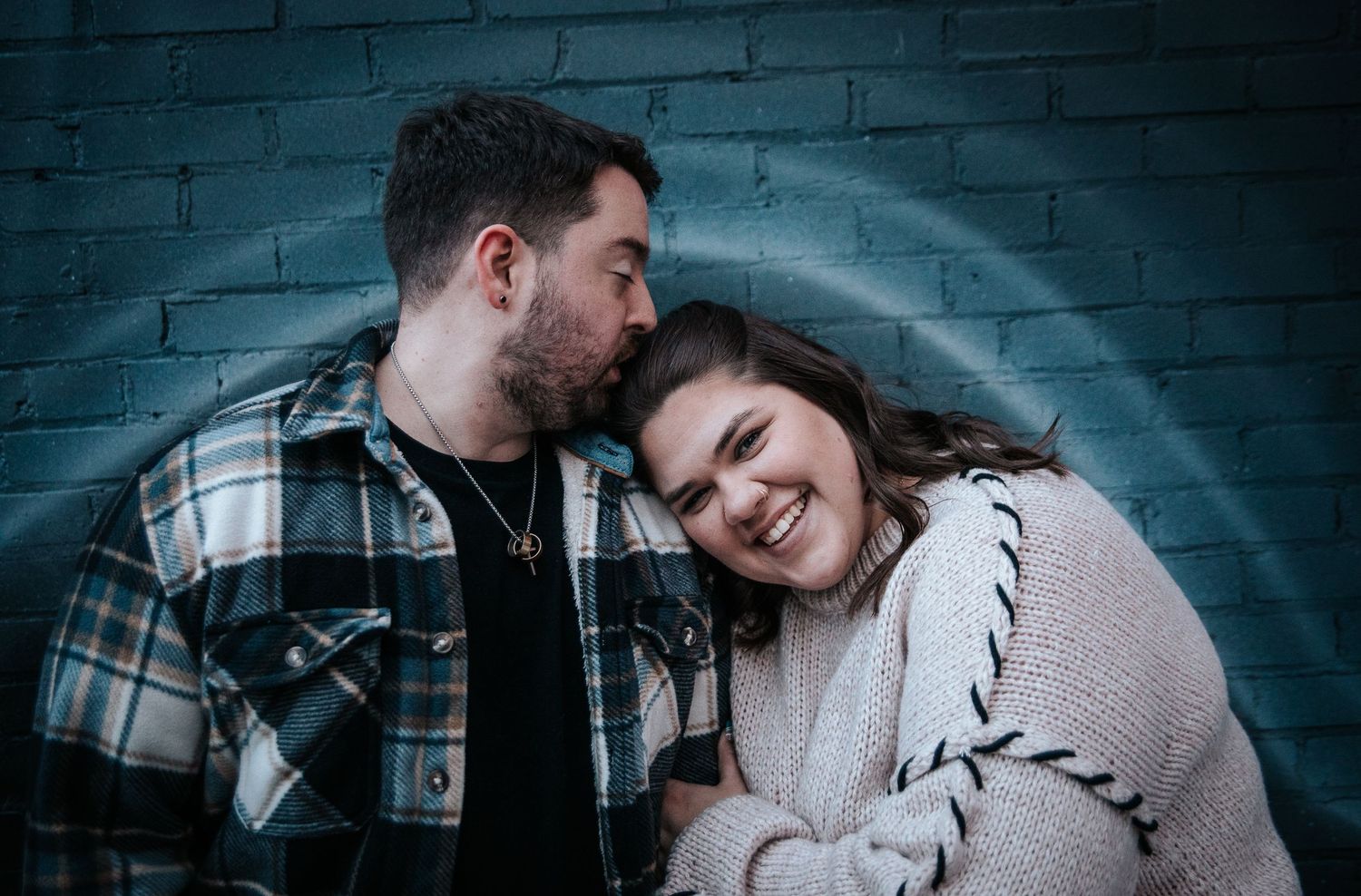 Couple in front of mural in Downtown Colorado Springs during engagement session