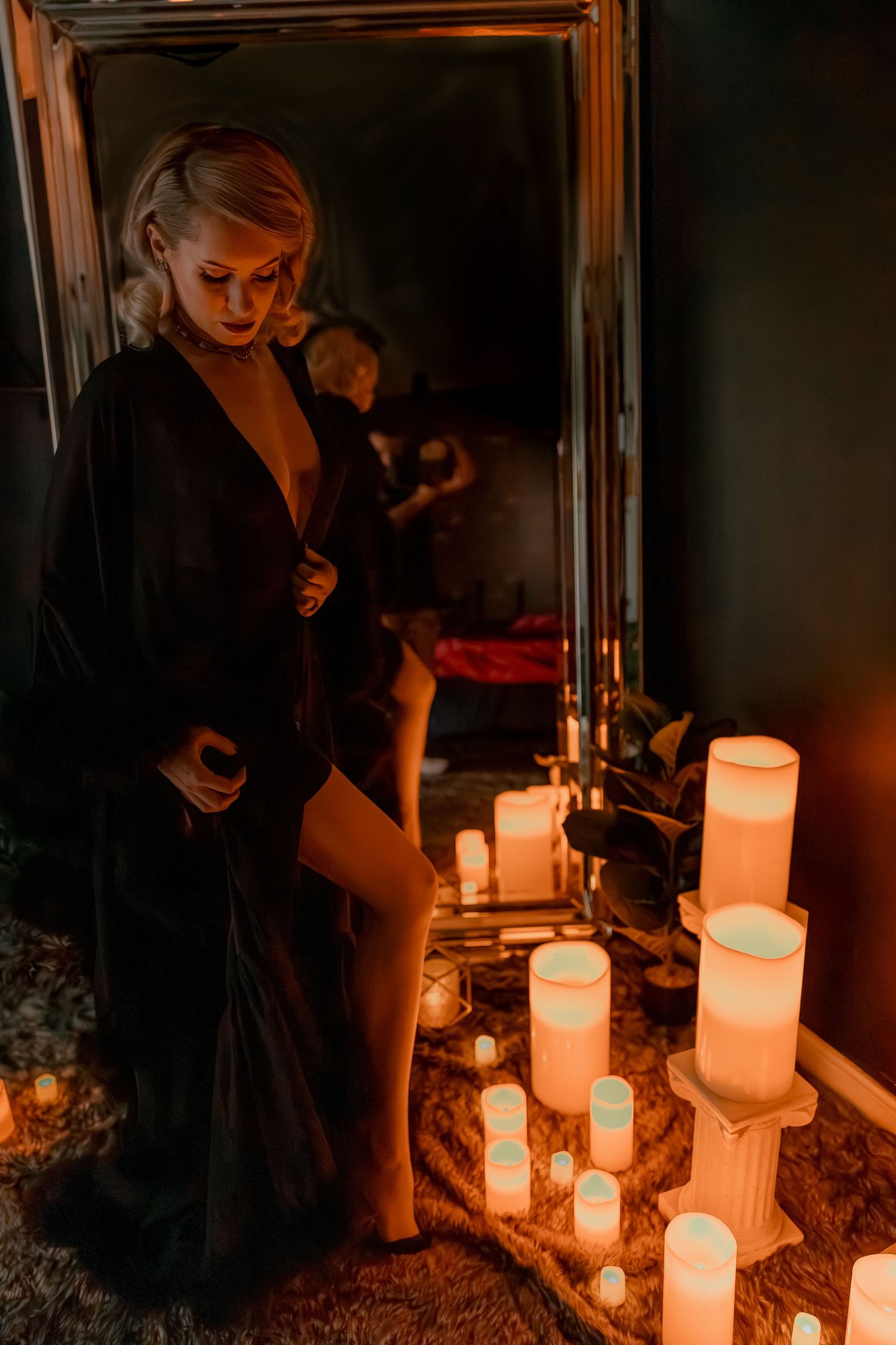 Atmospheric candlelit scene with multiple glowing candles creating warm ambiance.