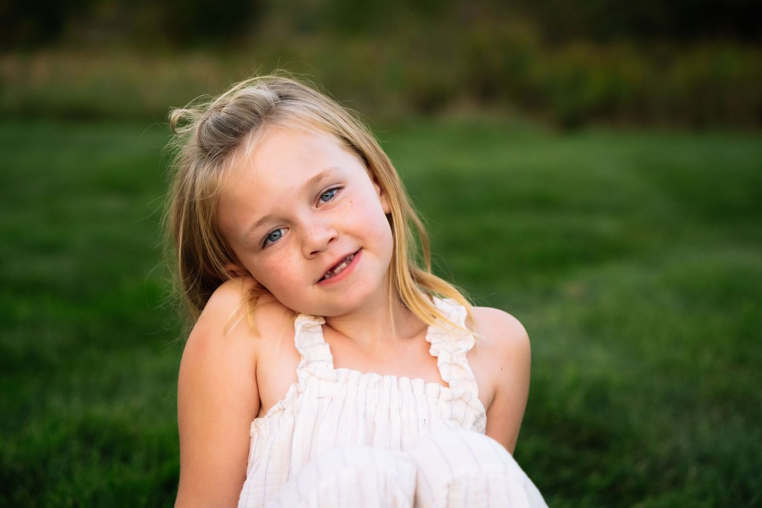 A series of outdoor portrait photographs showing a person in a white dress against a green natural background.