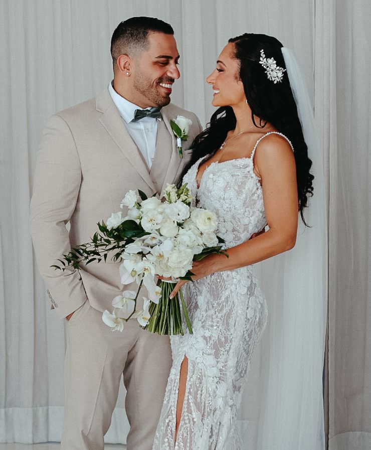 A bride and groom celebrating their destination wedding during a beautiful outdoor photo session in Mexico.
