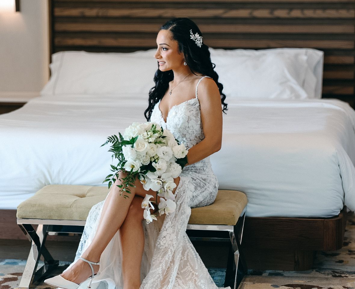 A bride celebrating her destination wedding during a beautiful outdoor photo session in Mexico.