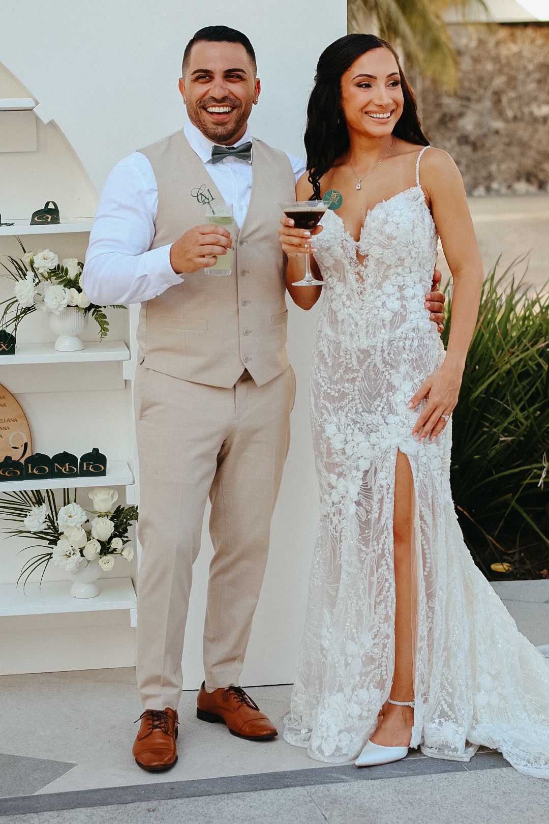 A bride and groom celebrating their destination wedding during a beautiful outdoor photo session in Mexico.