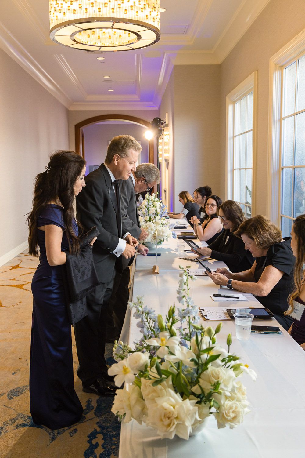 Guest checking in at registration table for Gala.