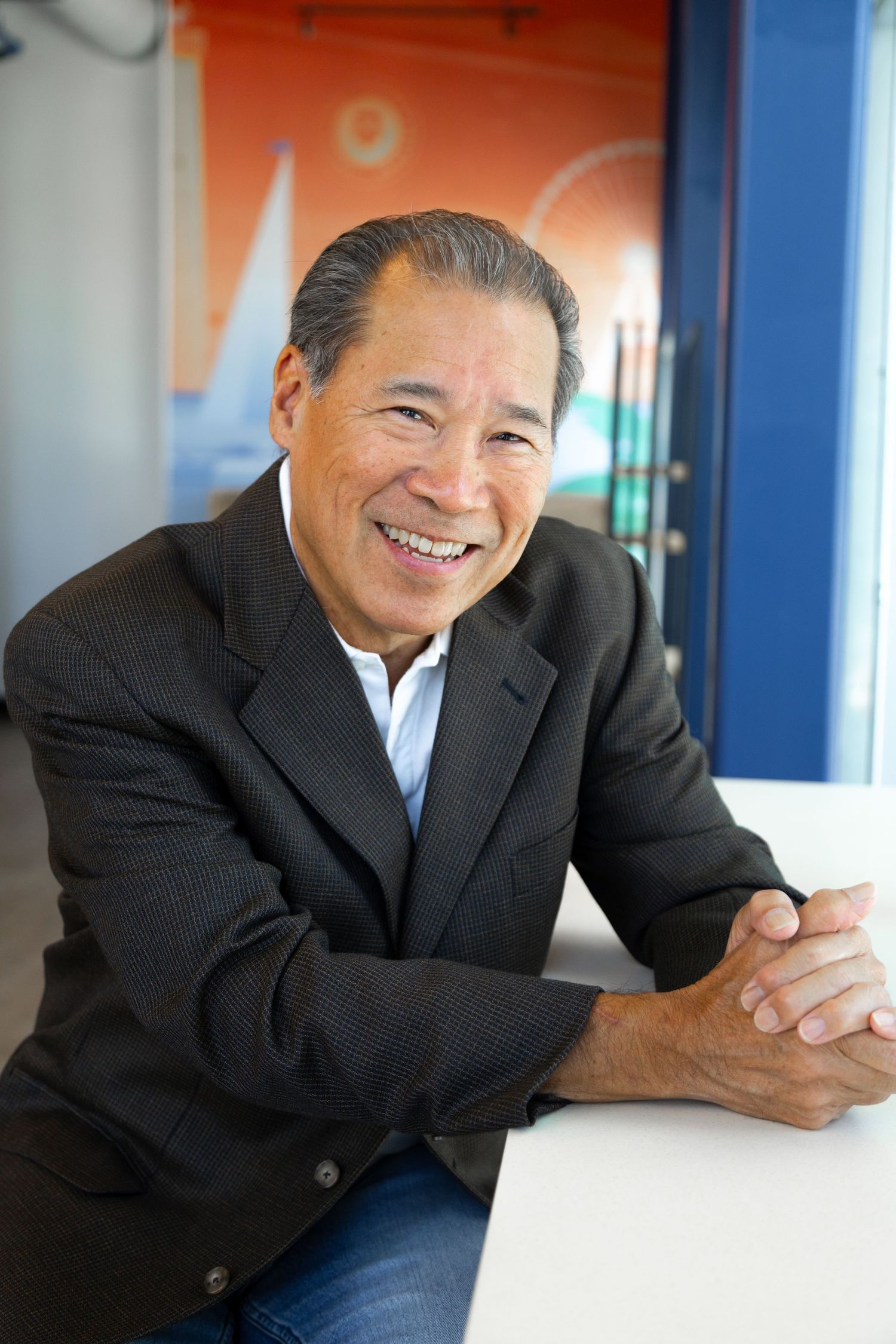 On-location portrait of a man for a dating site dressed in a blue blazer.