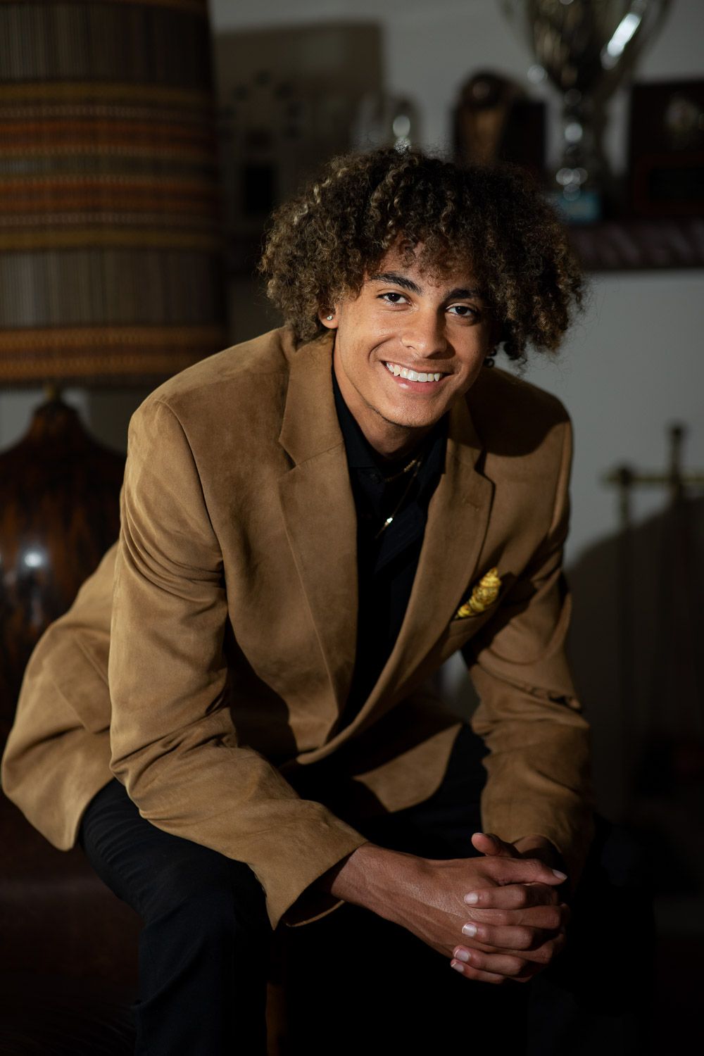 Warm lit on location using off camera flash for a studio look portrait.