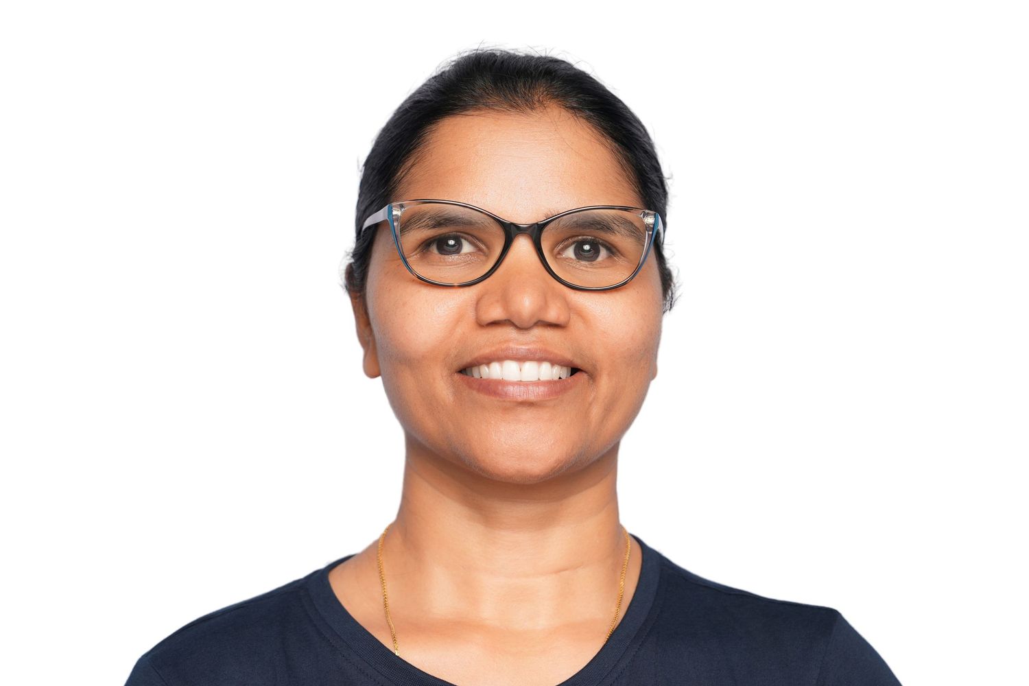 Headshot with a smiling woman with glasses and dark hair wearing a navy top against a white background.