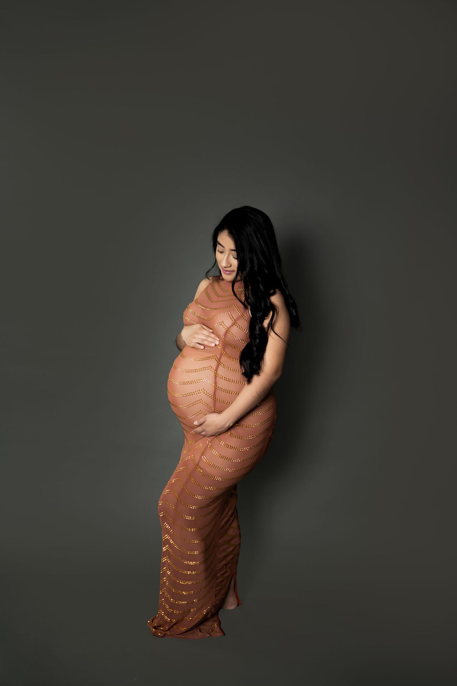 Artistic photo series showing a person wrapped in a brown blanket against a dark background.