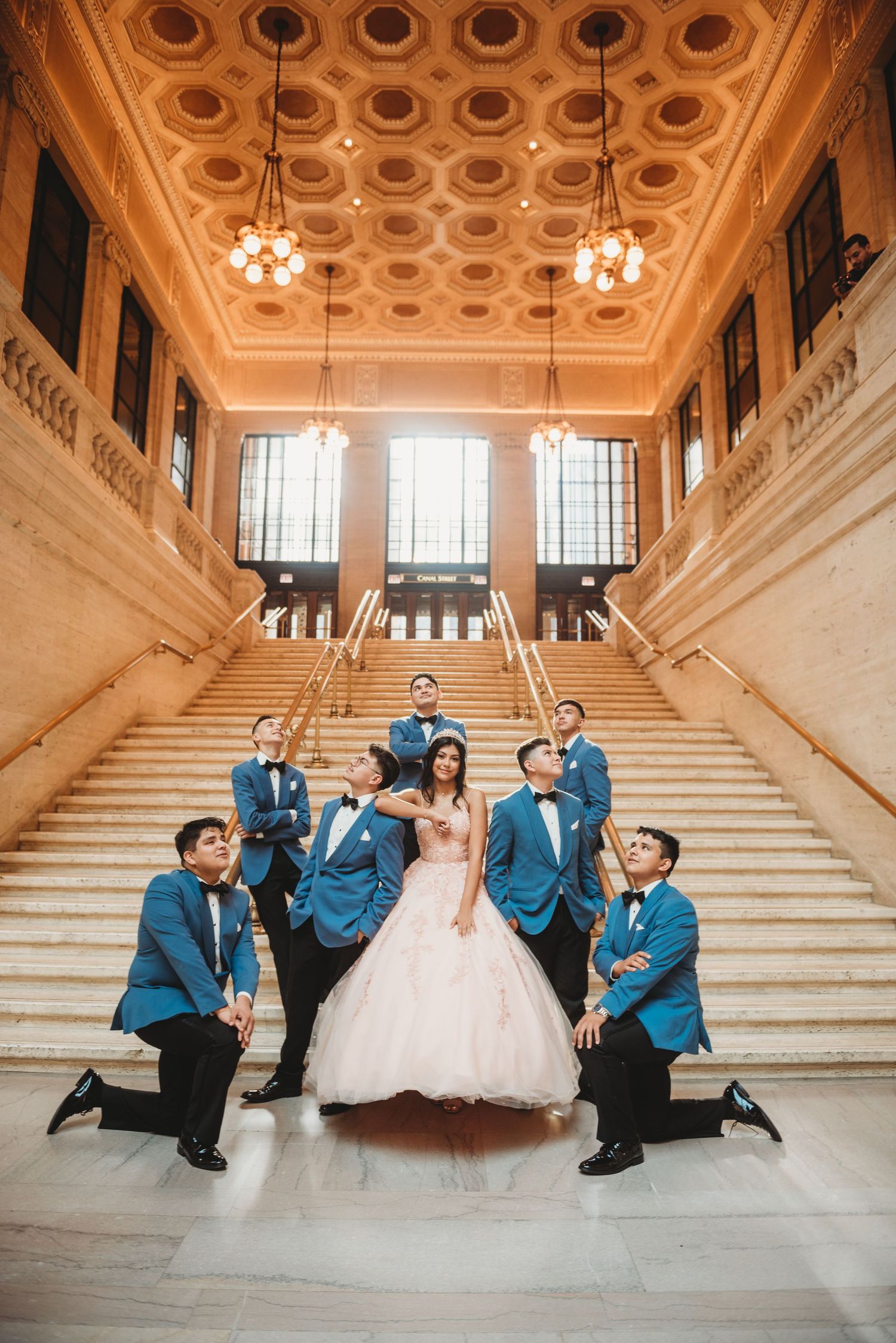 Elegant grand staircase with ornate ceiling details in historic building.