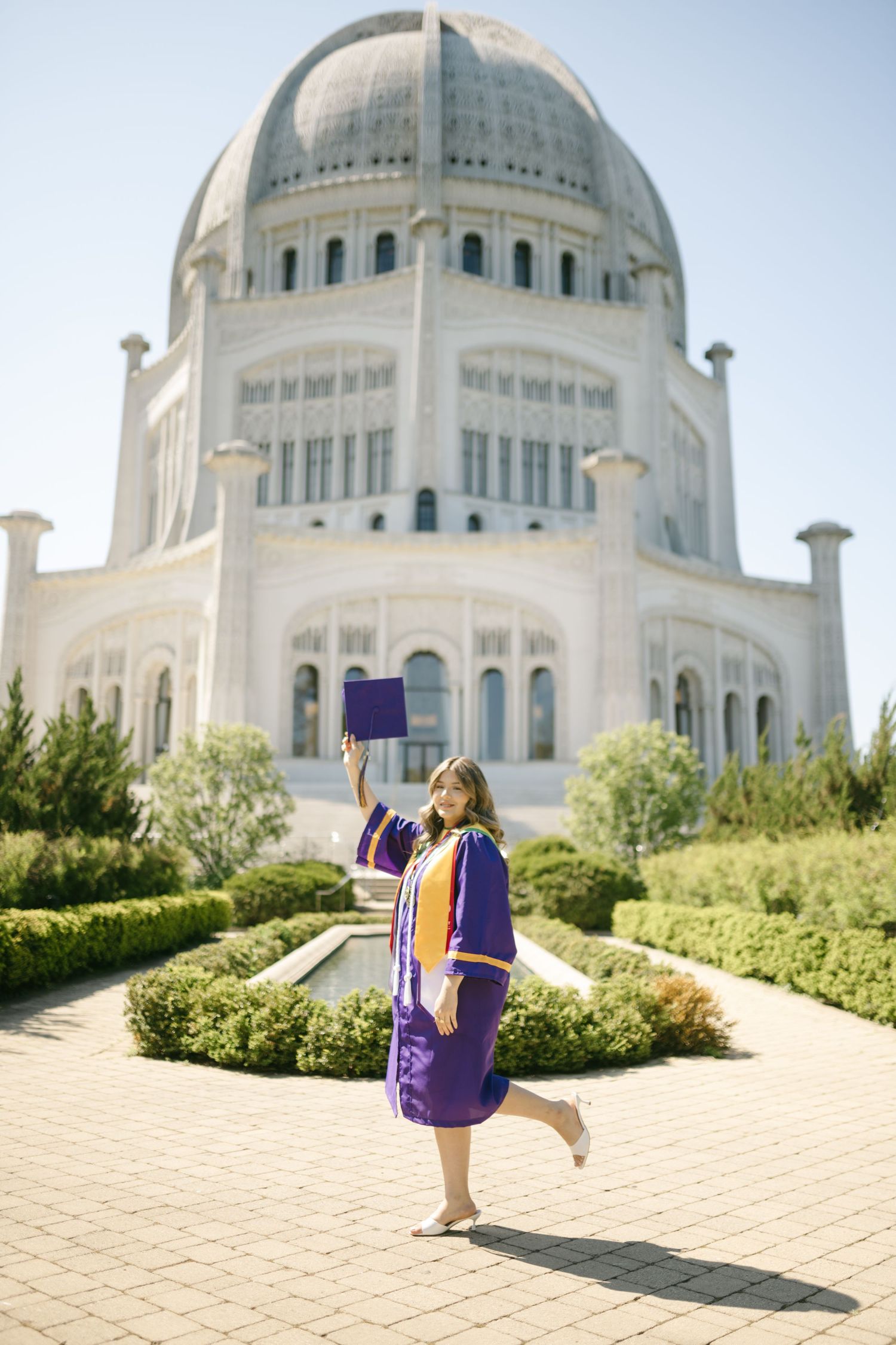 A series of photos showing a purple backpack against the white domed architecture of the Baha'i House of Worship in Illinois.