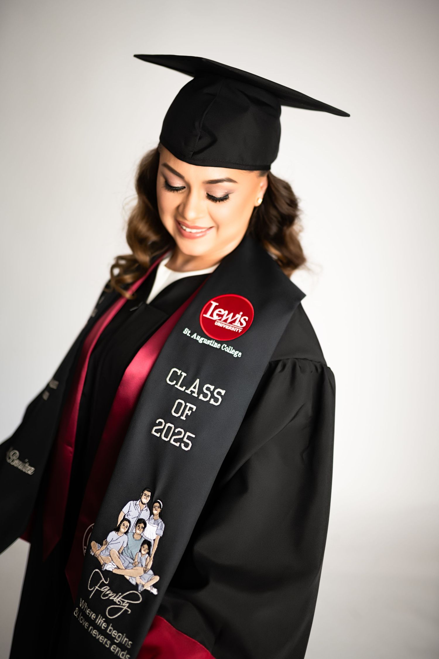 A graduation photoshoot featuring decorated academic regalia with Class of 2025 and Disney-themed designs.