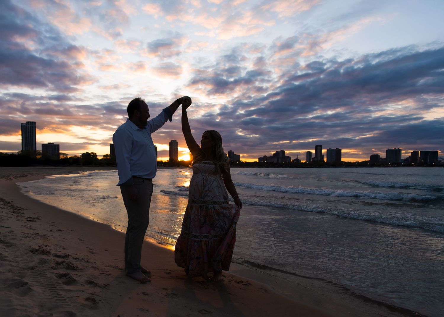 Chicago IL couples maternity session with flowing fabric and elegant posing