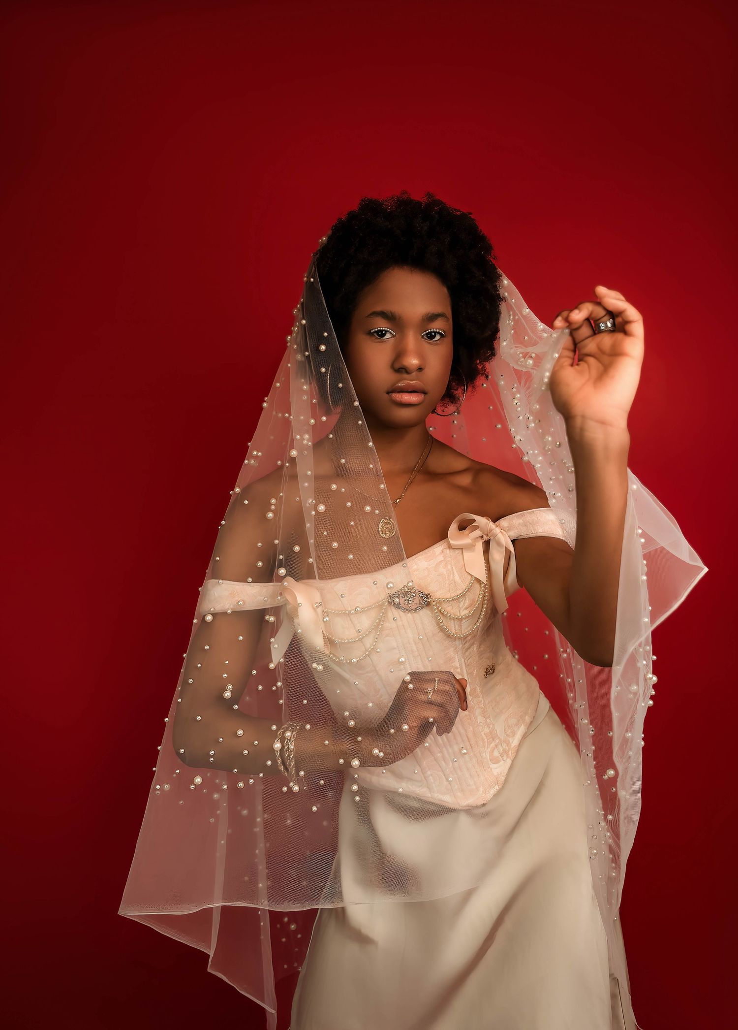 Posed bridal portrait with veil in studio in Central Illinois and princess corset
