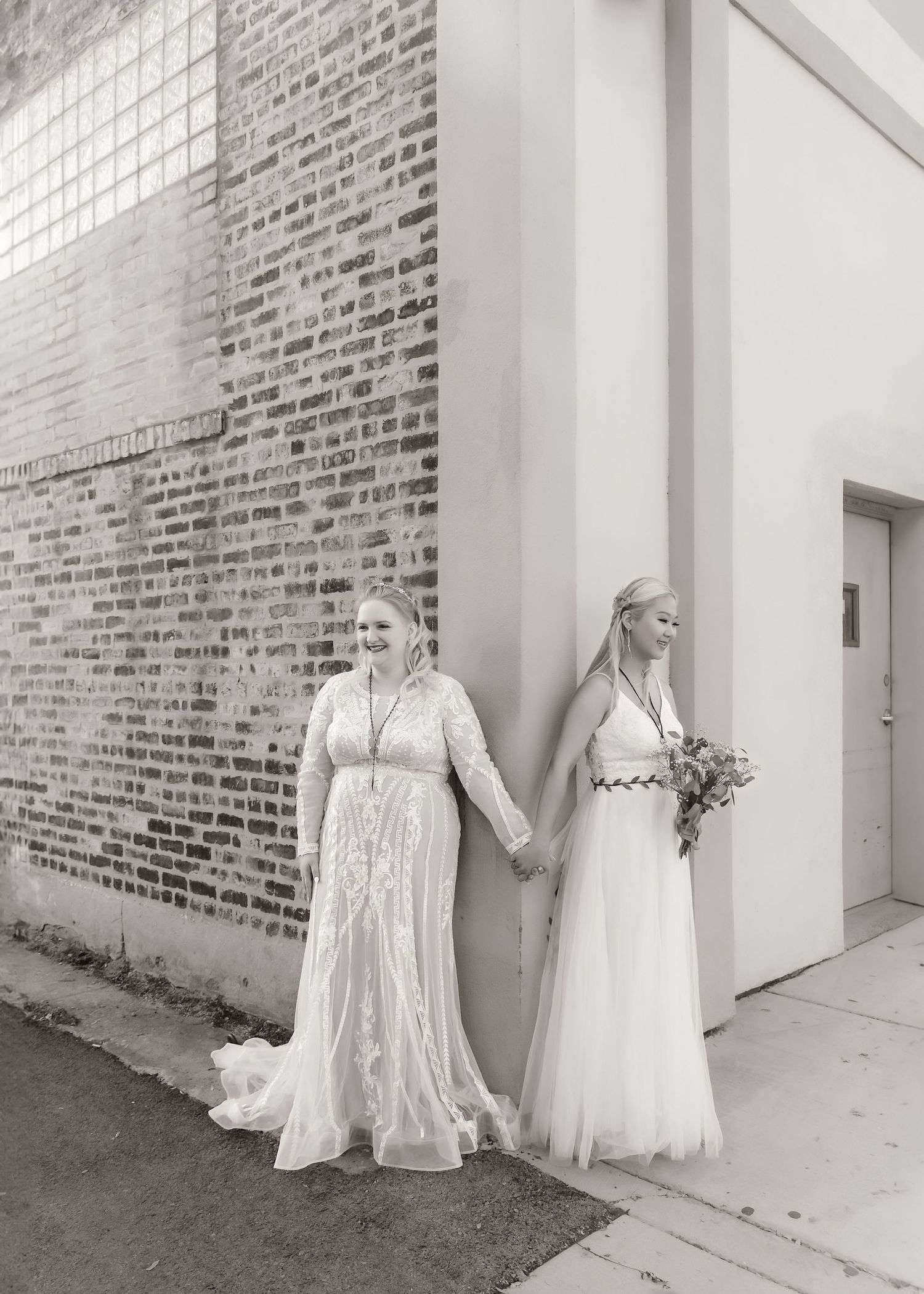 First look during wedding with LGBTQAI+ couple in black and white in Chicago