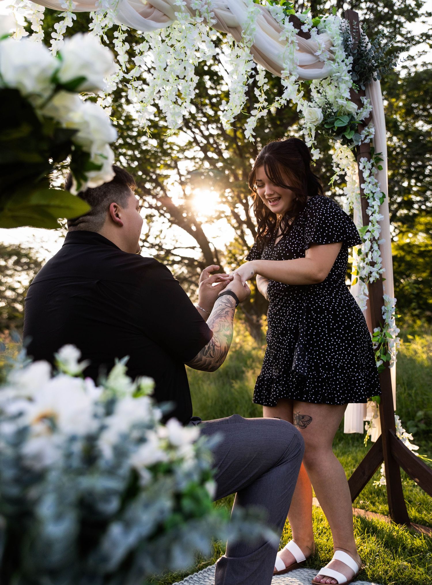 Surprise proposal photoshoot at Donovan Park in Peoria with flowers