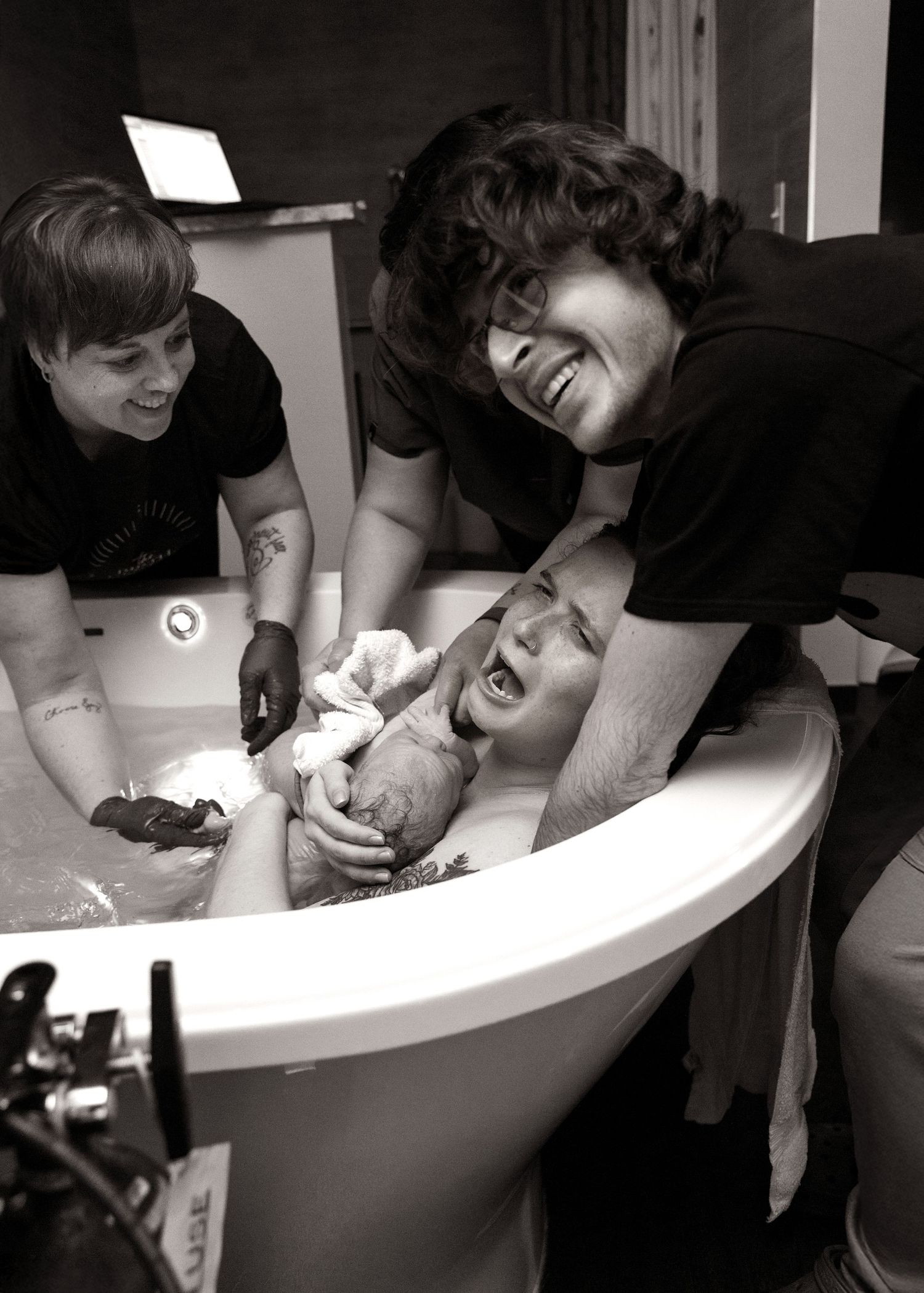 The moment you find out your baby is a girl. Birth Photography in tub in Bloomington, IL