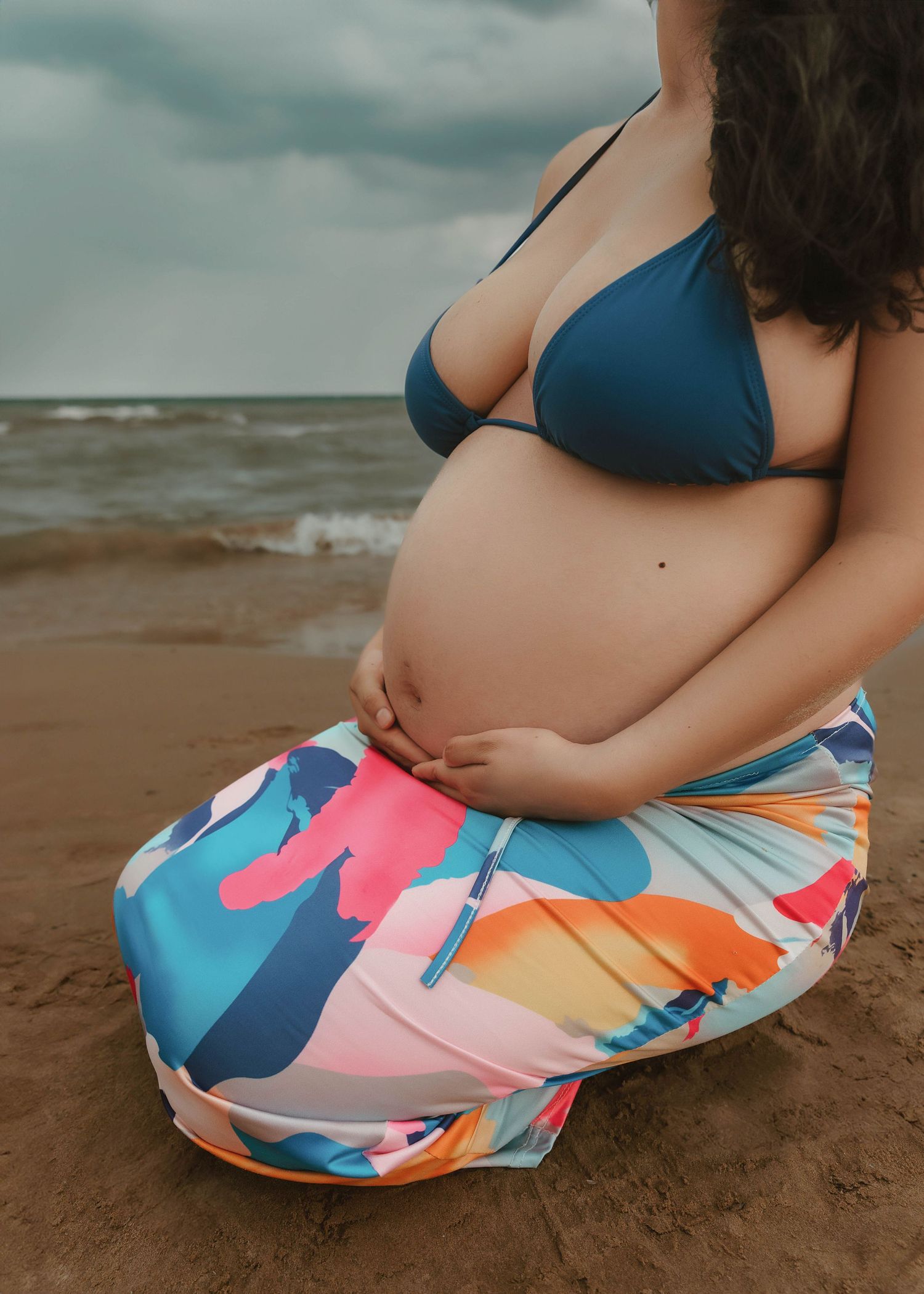 Outdoor beach maternity session in Chicago Illinois capturing motherhood and connection
