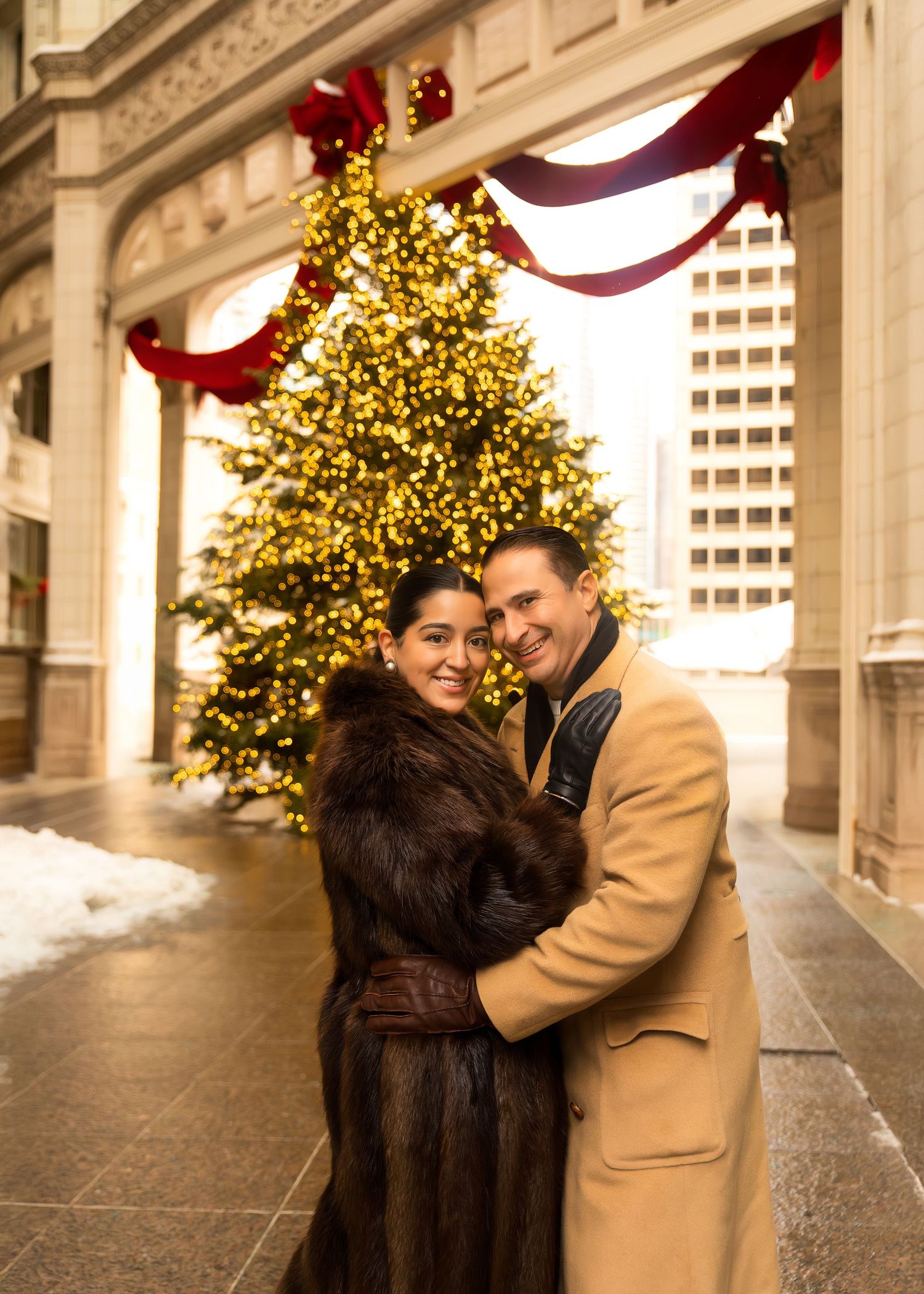 Couples Christmas photos at the Wrigley building Christmas tree in the city of Chicago