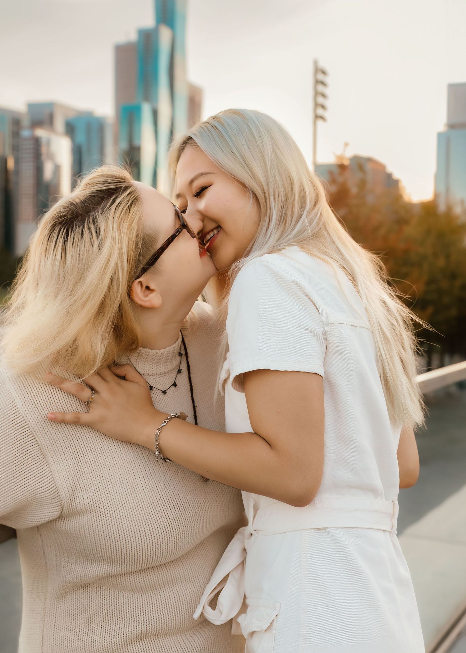 LGBTQ+ couples engagement photo on Navy Pier in Chicago with natural posing
