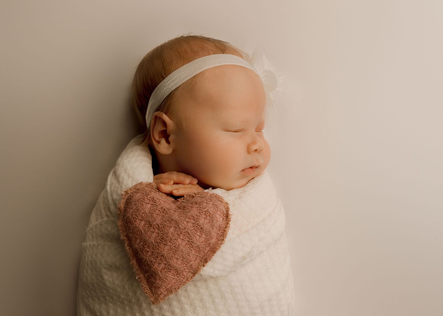 Posed Newborn session in-studio in Peoria Illinois