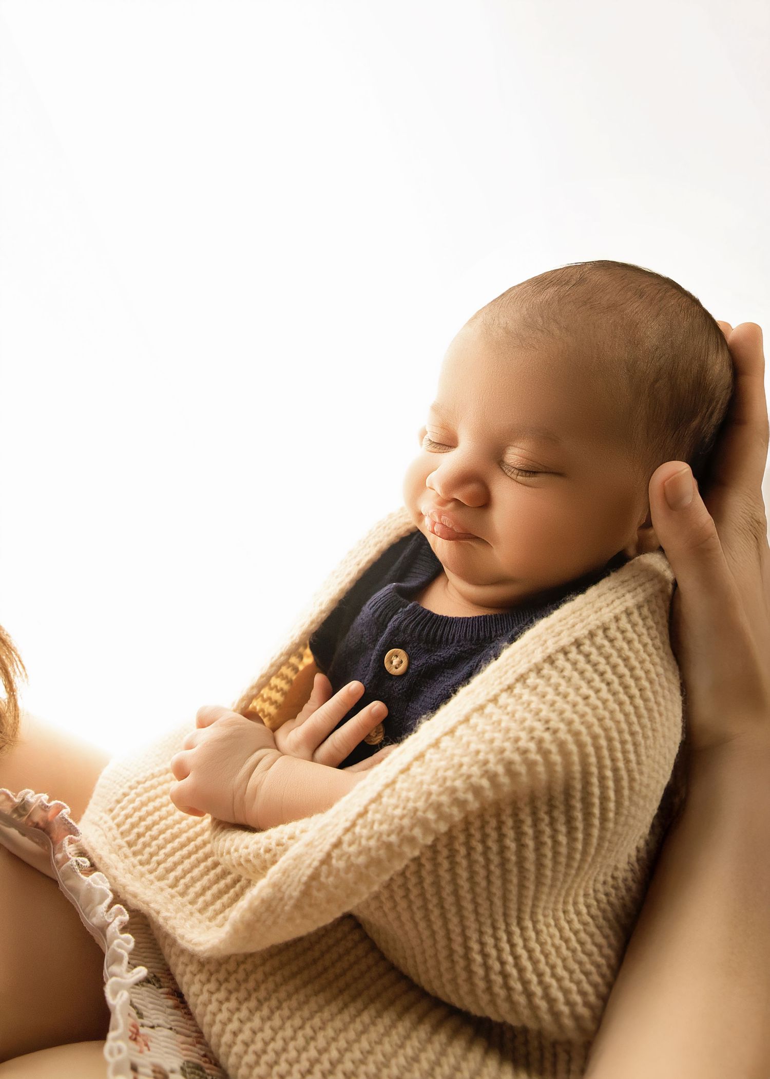Baby boy snuggling with mom at the Studio on Sampson in Tremont Illinois, Lifestyle newborn session with loose wrap