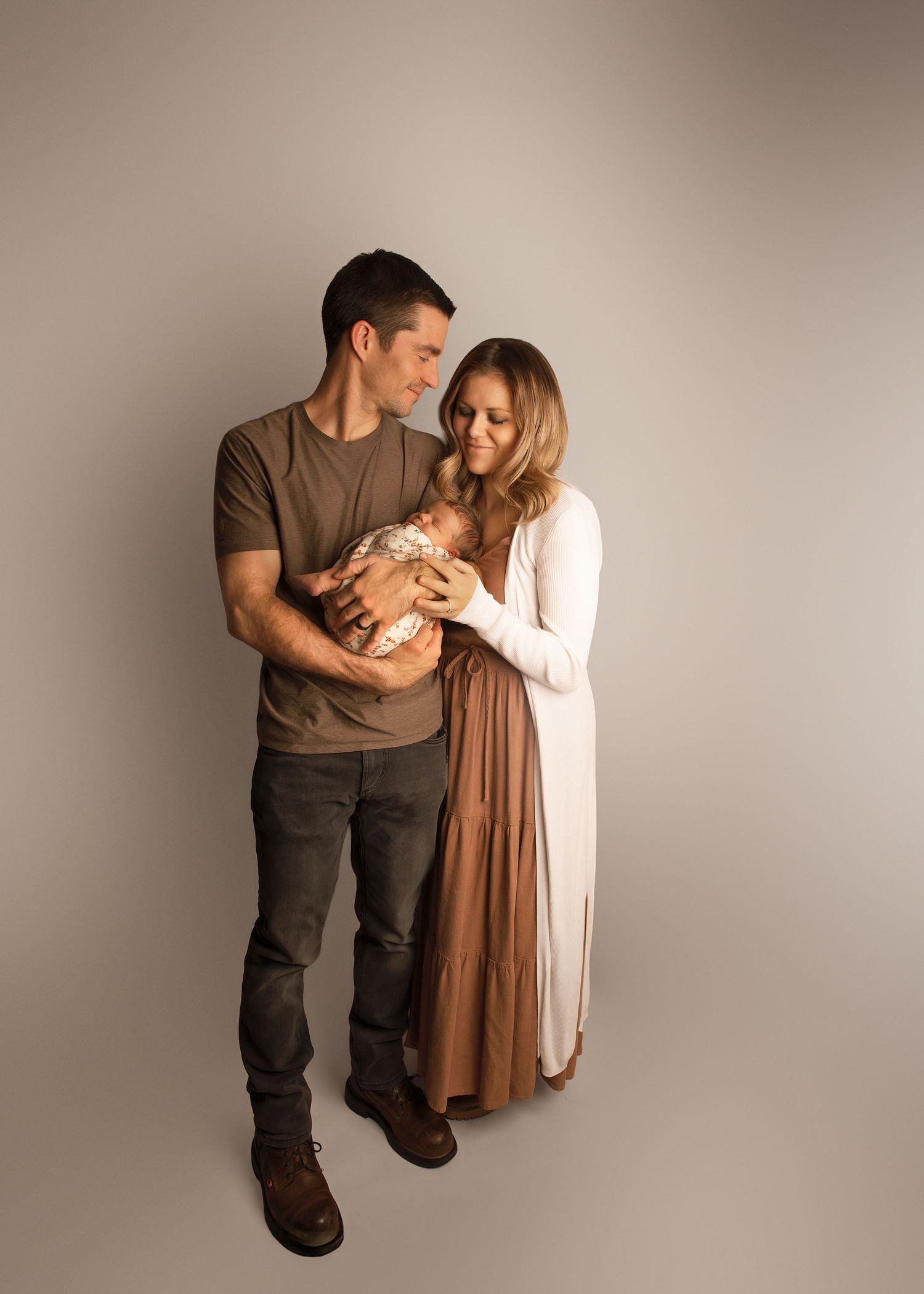 In-studio Posed Newborn Shot with mom & dad