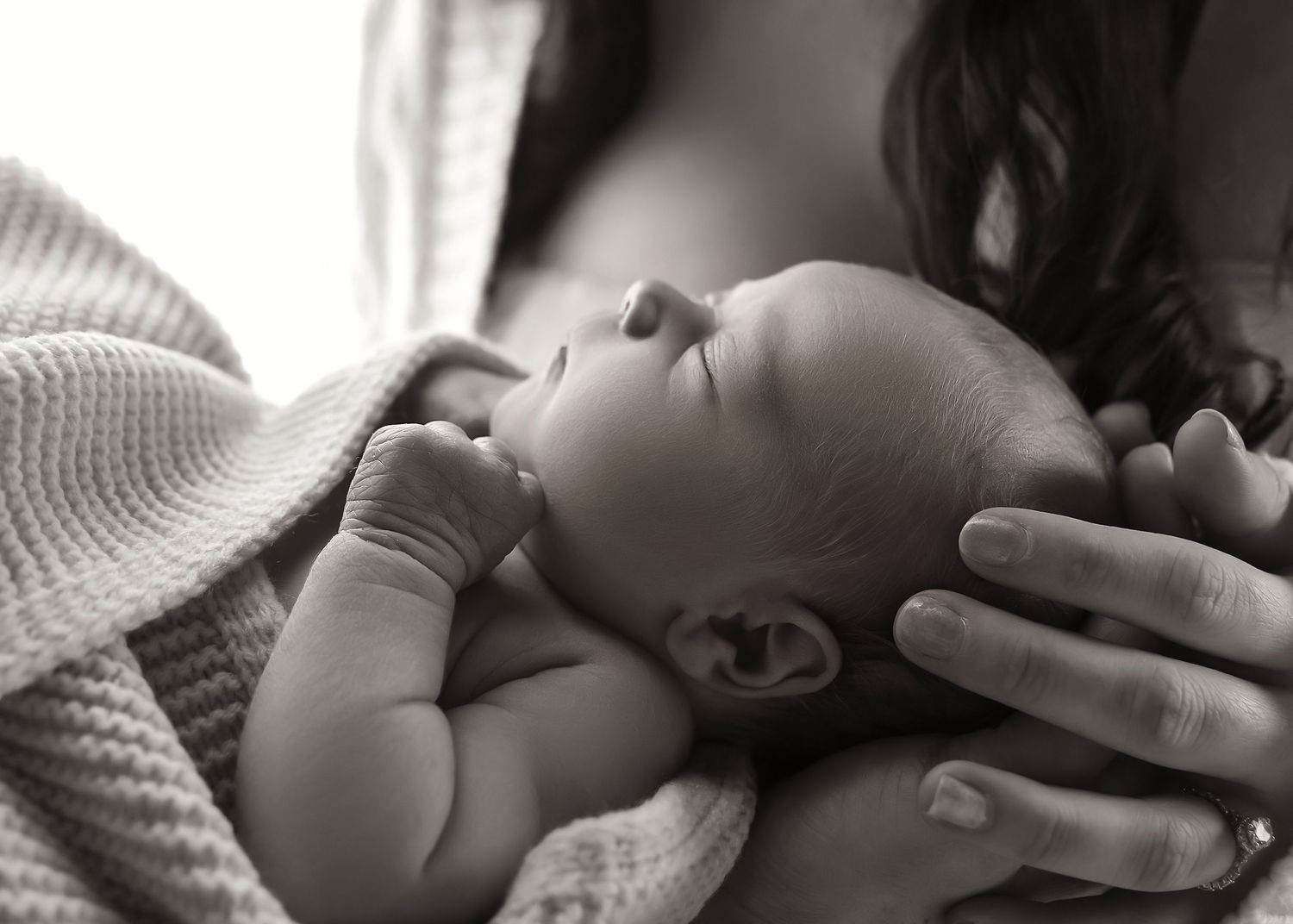 Newborn photoshoot in Tremont Illinois at the Studio on Sampson with baby's details being the focus, in black and white