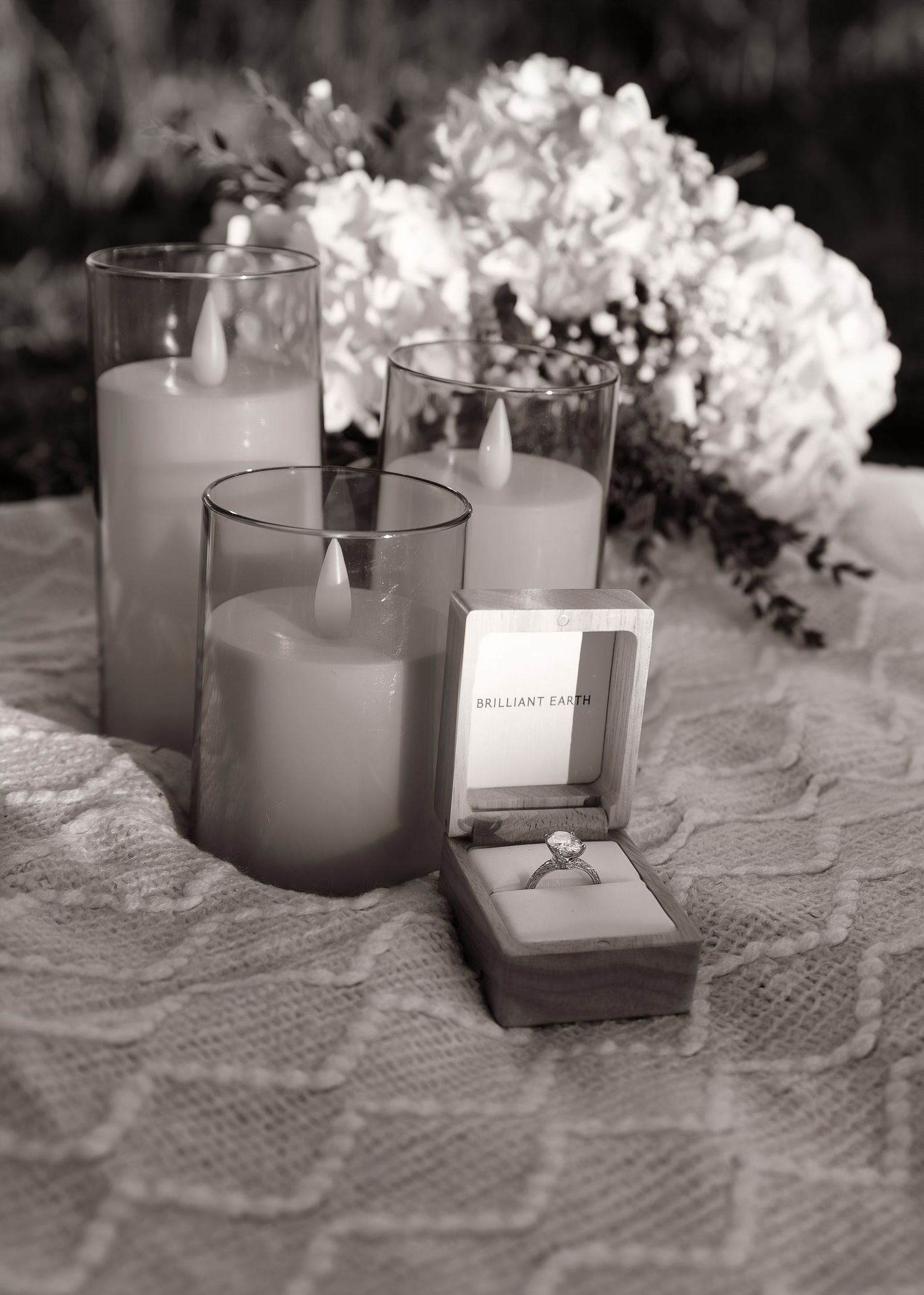 Detail environment shot with ring and florals before surprise proposal on Grandview Drive in Central Illinois