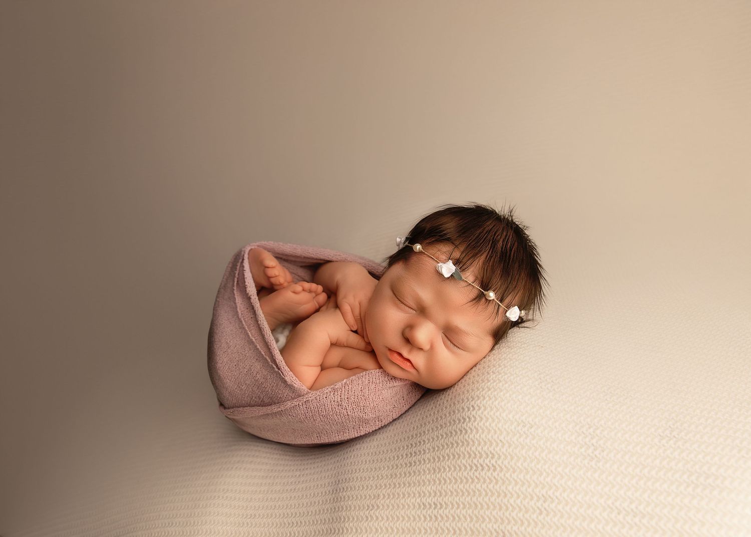 Posed newborn session in studio in Peoria, IL