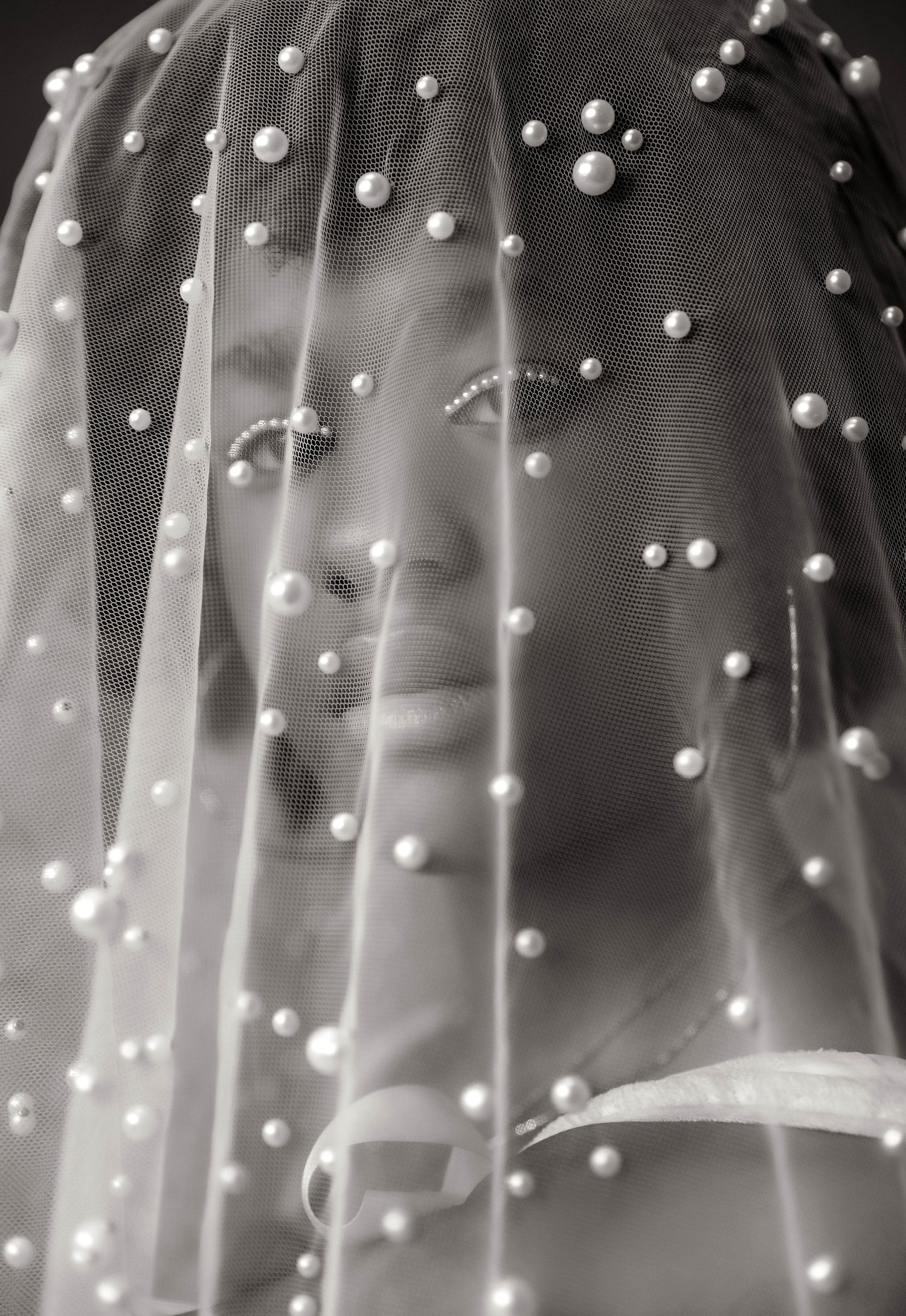 Close up bridal portrait with pearl veil in black and white studio in Peoria