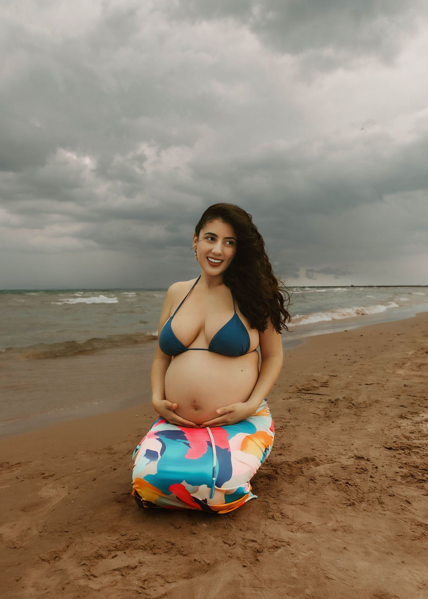 Beach Swim maternity session on overcast day on Montrose Beach in Chicago, IL