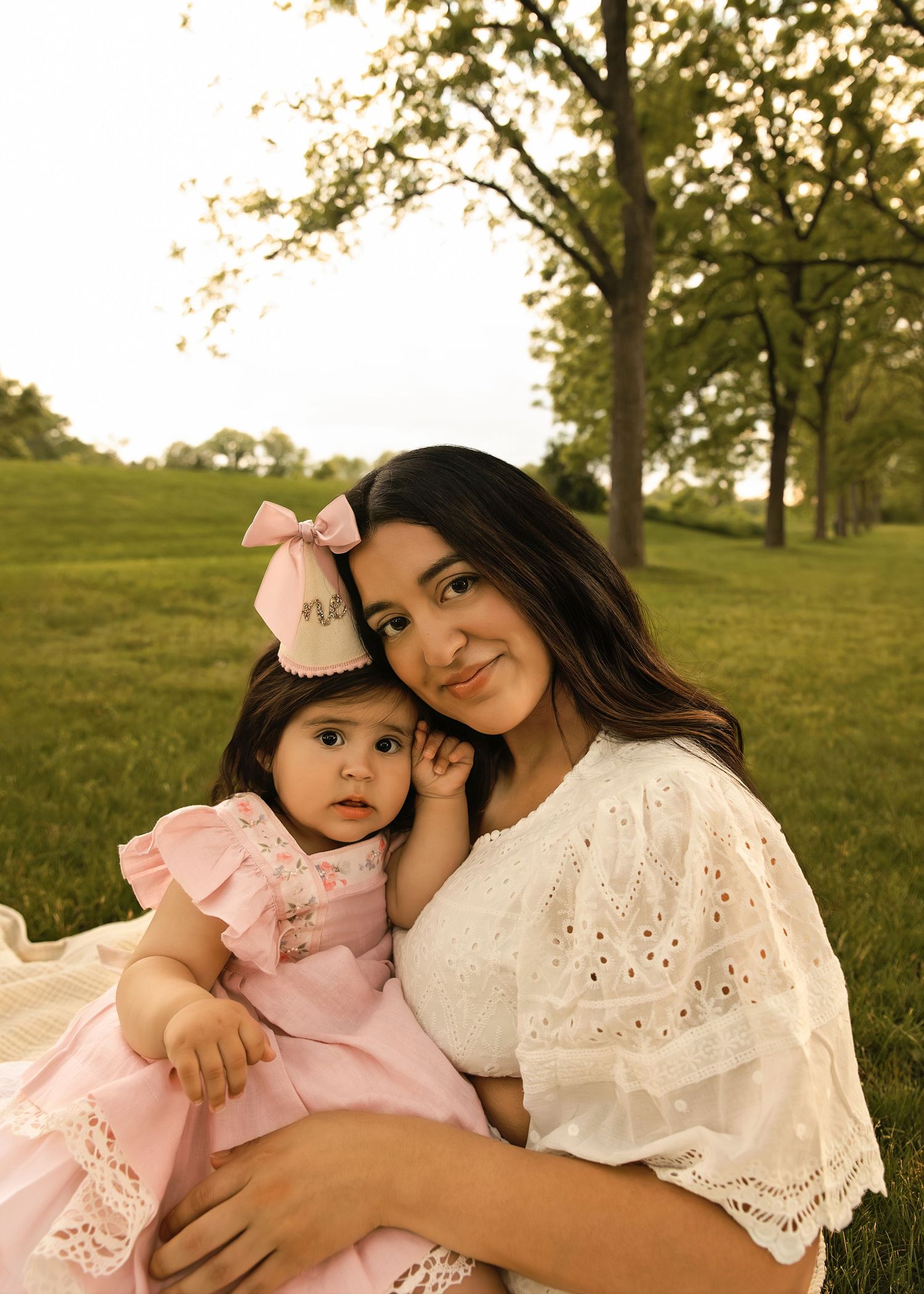 Close up portrait of mom and her baby girl with birthday hat on in Naperville Illinois