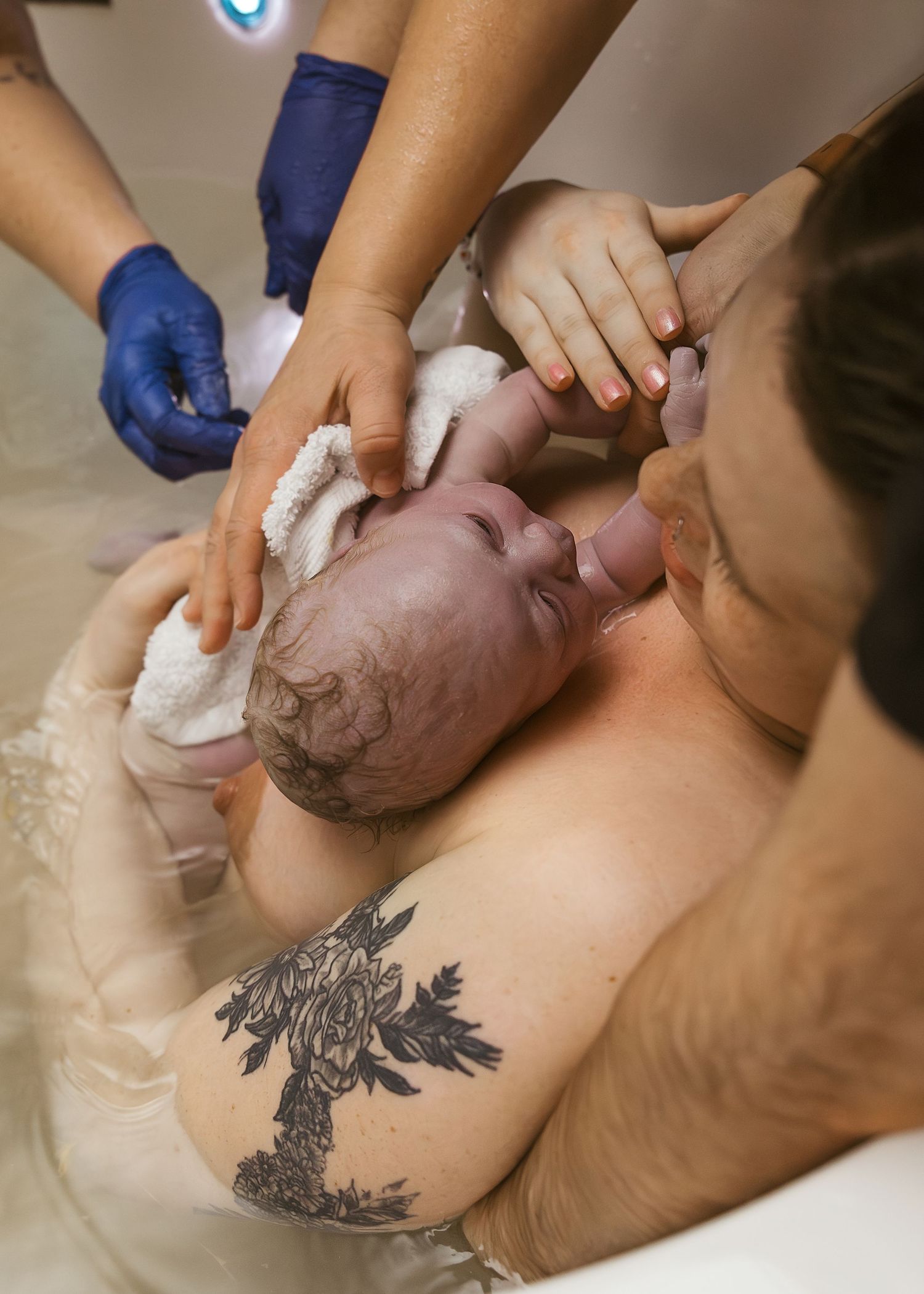 Birth Photography in tub in Bloomington, IL